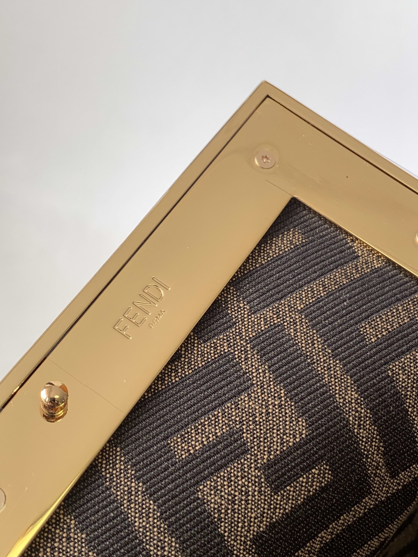 Fendi Avocado Green Leather and Python Small First Clutch, featuring an iconic oversized 'F' clasp and a detachable shoulder strap