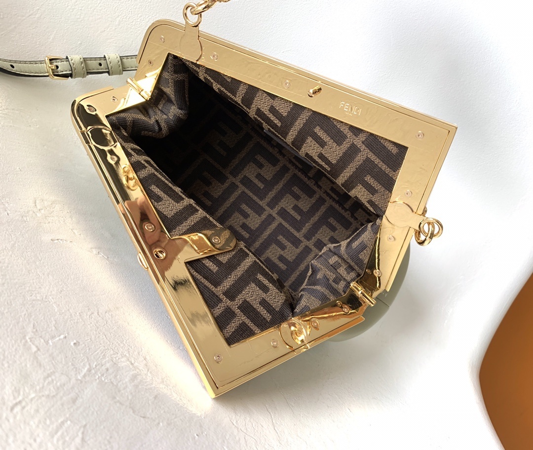 Fendi Avocado Green Leather and Python Small First Clutch, featuring an iconic oversized 'F' clasp and a detachable shoulder strap