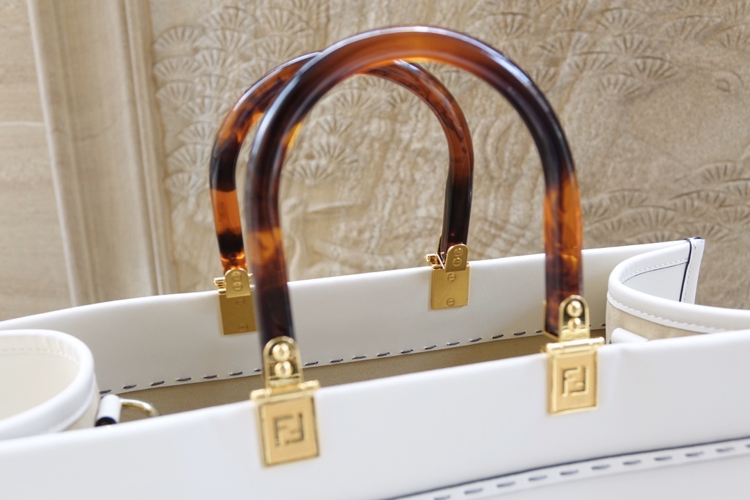 Fendi Sunshine Medium tote bag featuring tortoiseshell-effect plexiglass handles and gold-finish metal hardware