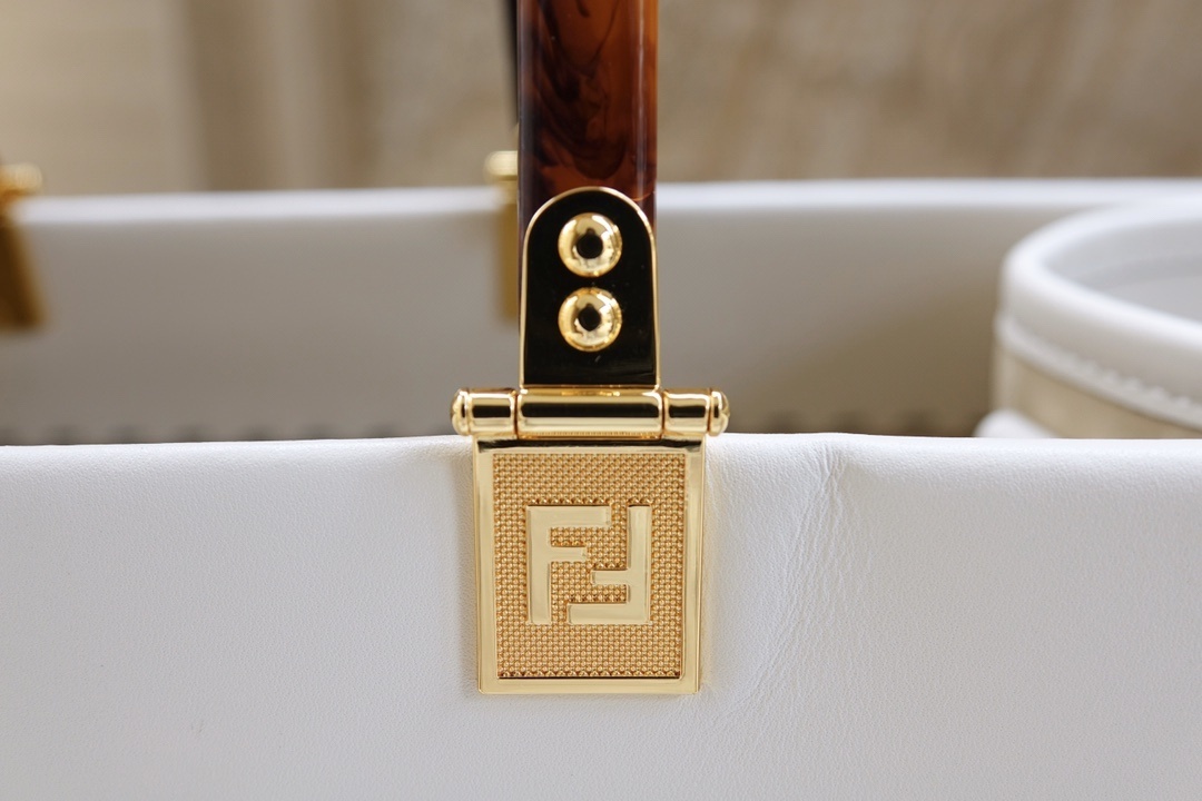 Fendi Sunshine Medium tote bag featuring tortoiseshell-effect plexiglass handles and gold-finish metal hardware