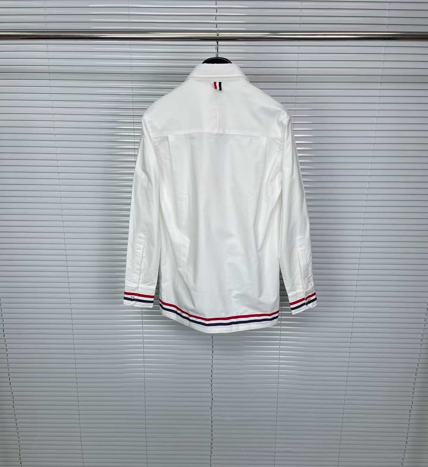 Thom Browne white cotton poplin shirt featuring the signature RWB stripe trim on the cuffs and hem