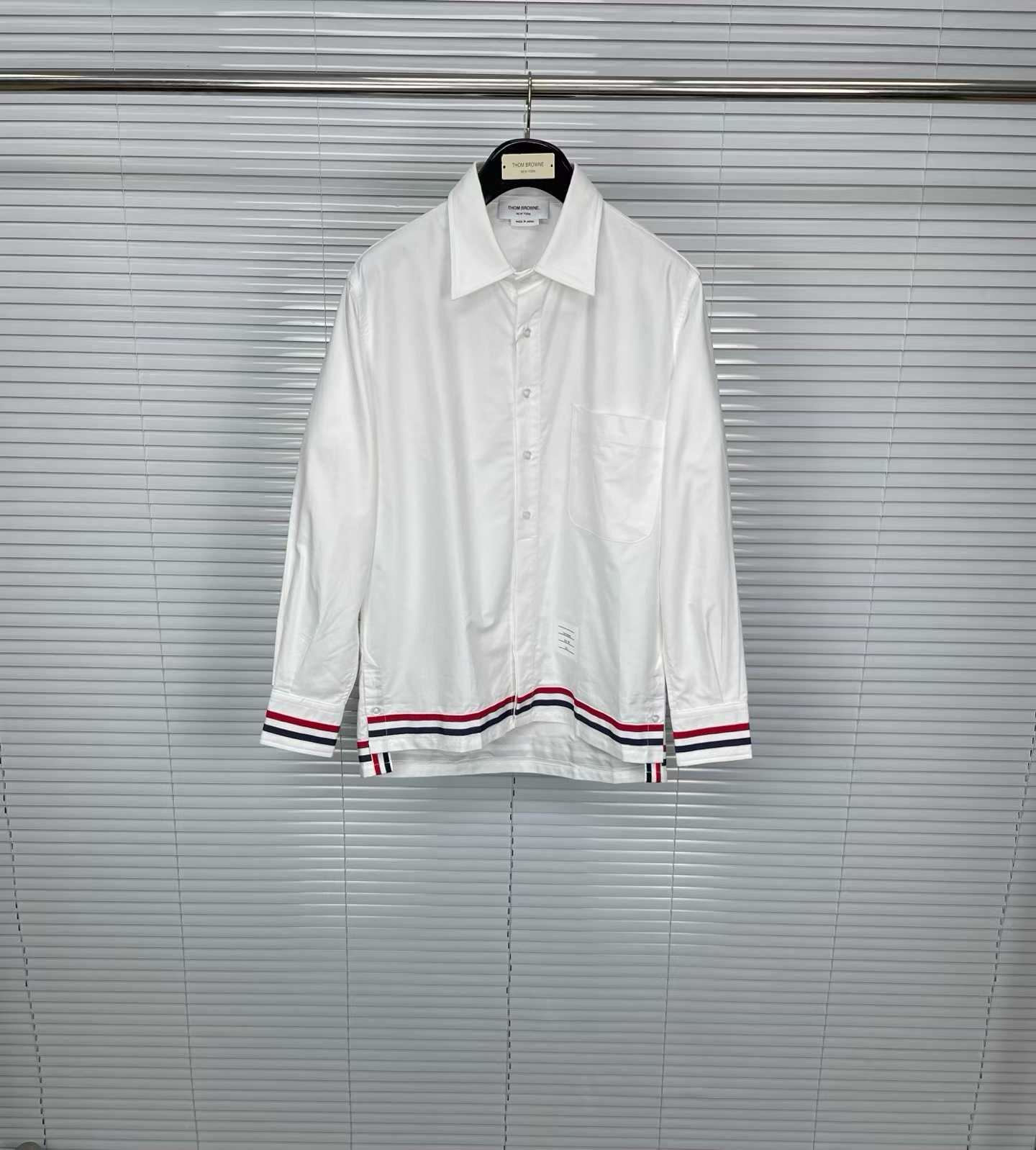 Thom Browne white cotton poplin shirt featuring the signature RWB stripe trim on the cuffs and hem