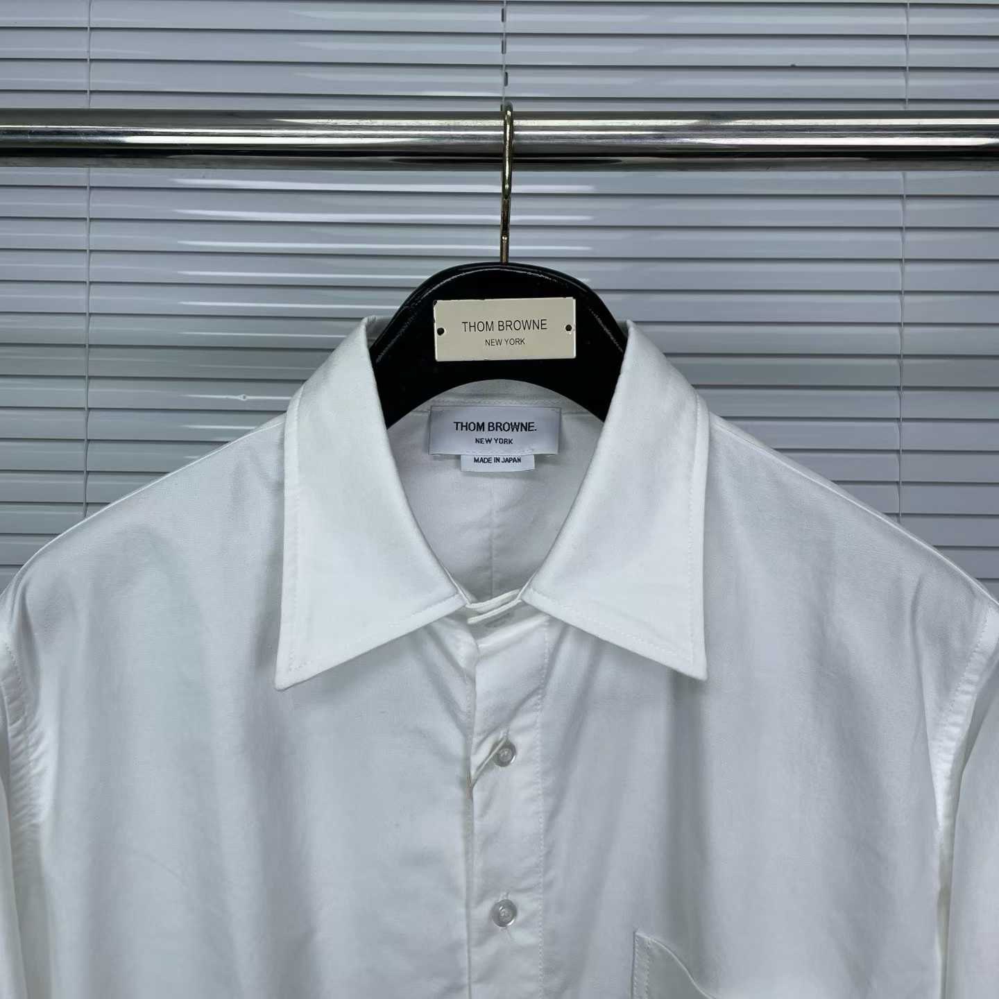 Thom Browne white cotton poplin shirt featuring the signature RWB stripe trim on the cuffs and hem