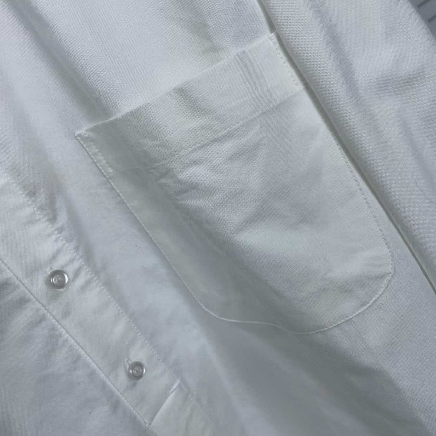 Thom Browne white cotton poplin shirt featuring the signature RWB stripe trim on the cuffs and hem