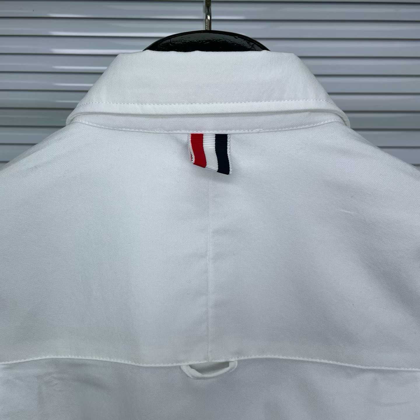 Thom Browne white cotton poplin shirt featuring the signature RWB stripe trim on the cuffs and hem