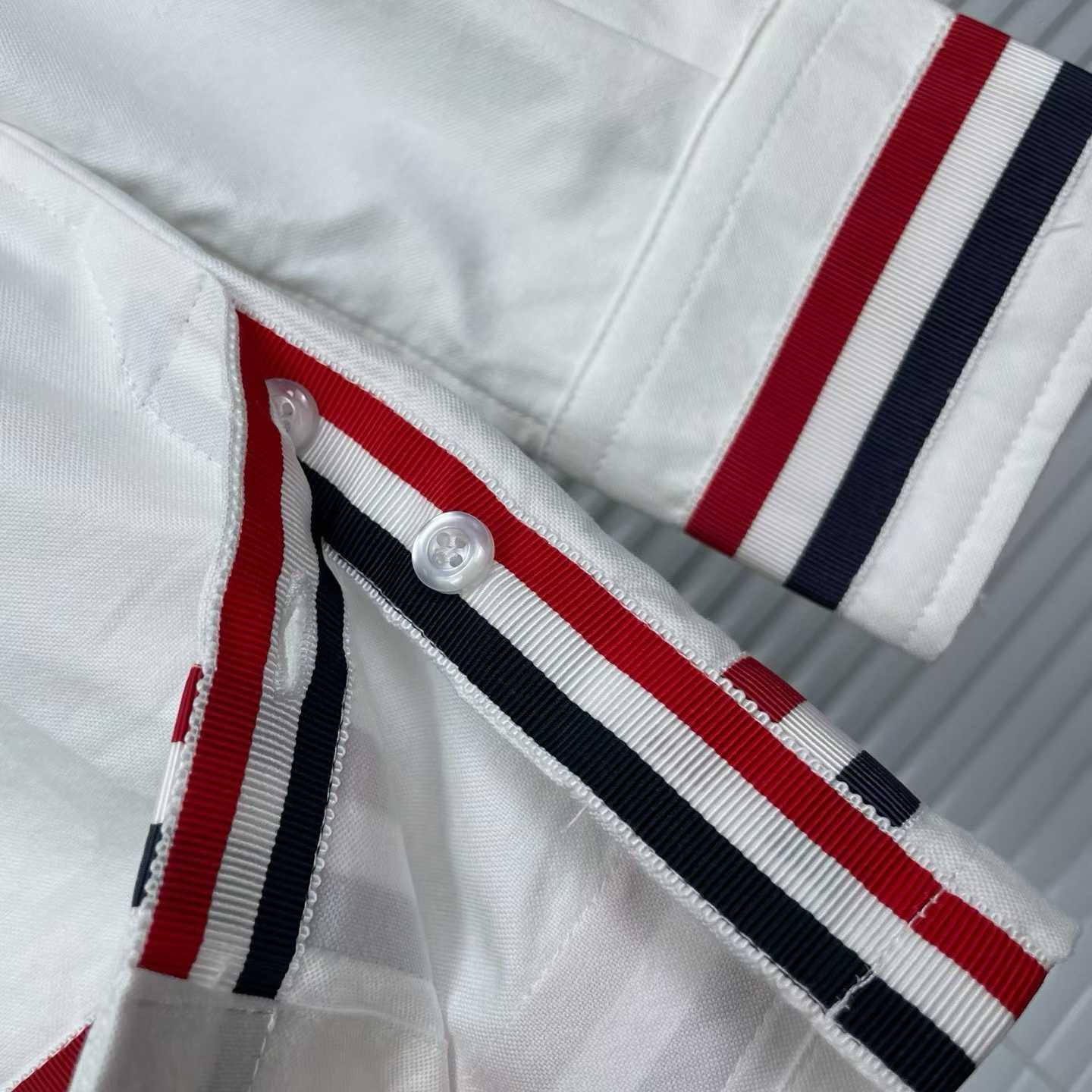 Thom Browne white cotton poplin shirt featuring the signature RWB stripe trim on the cuffs and hem