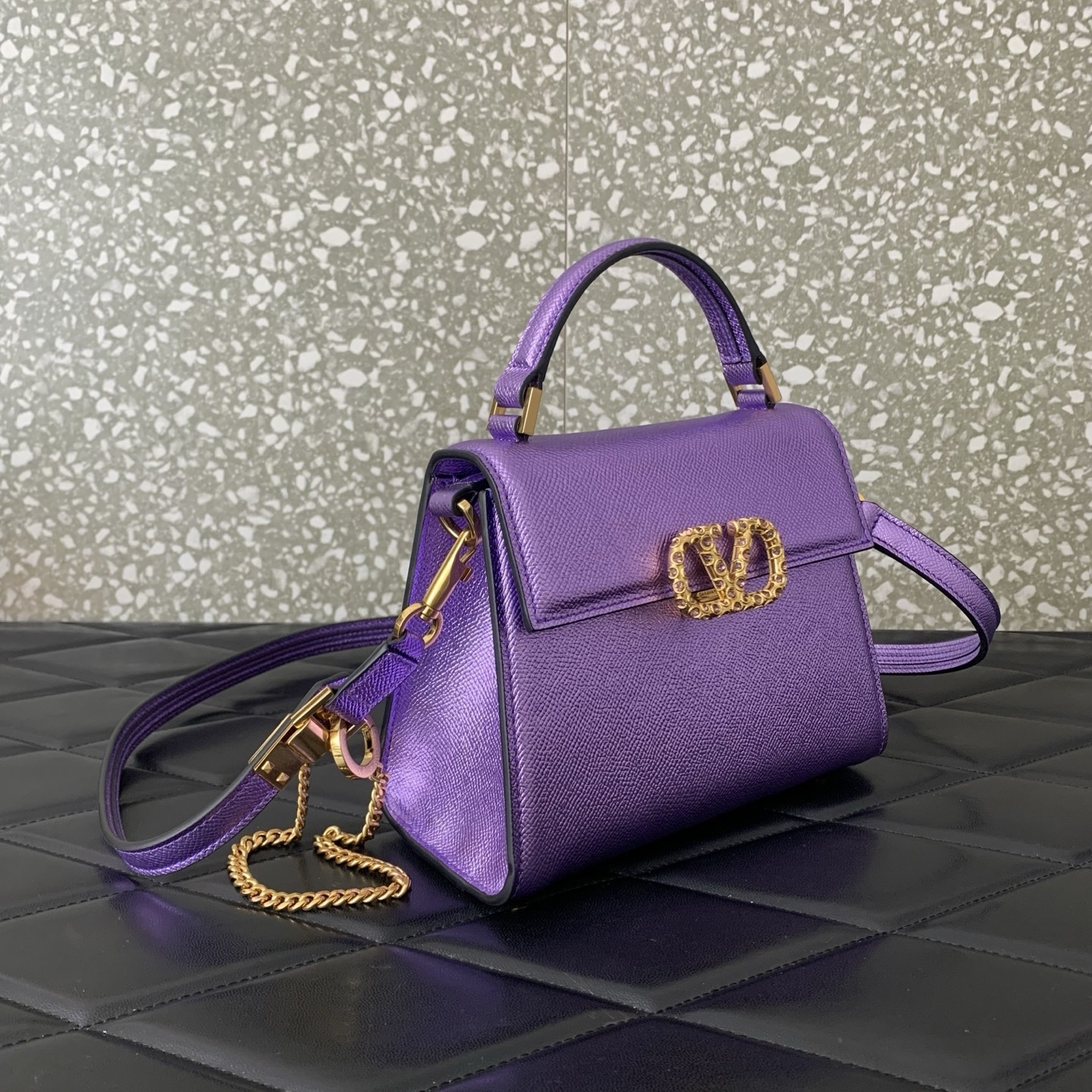 Valentino Garavani Vsling Mini Top-Handle Bag in purple metallic grainy calfskin with antique brass hardware