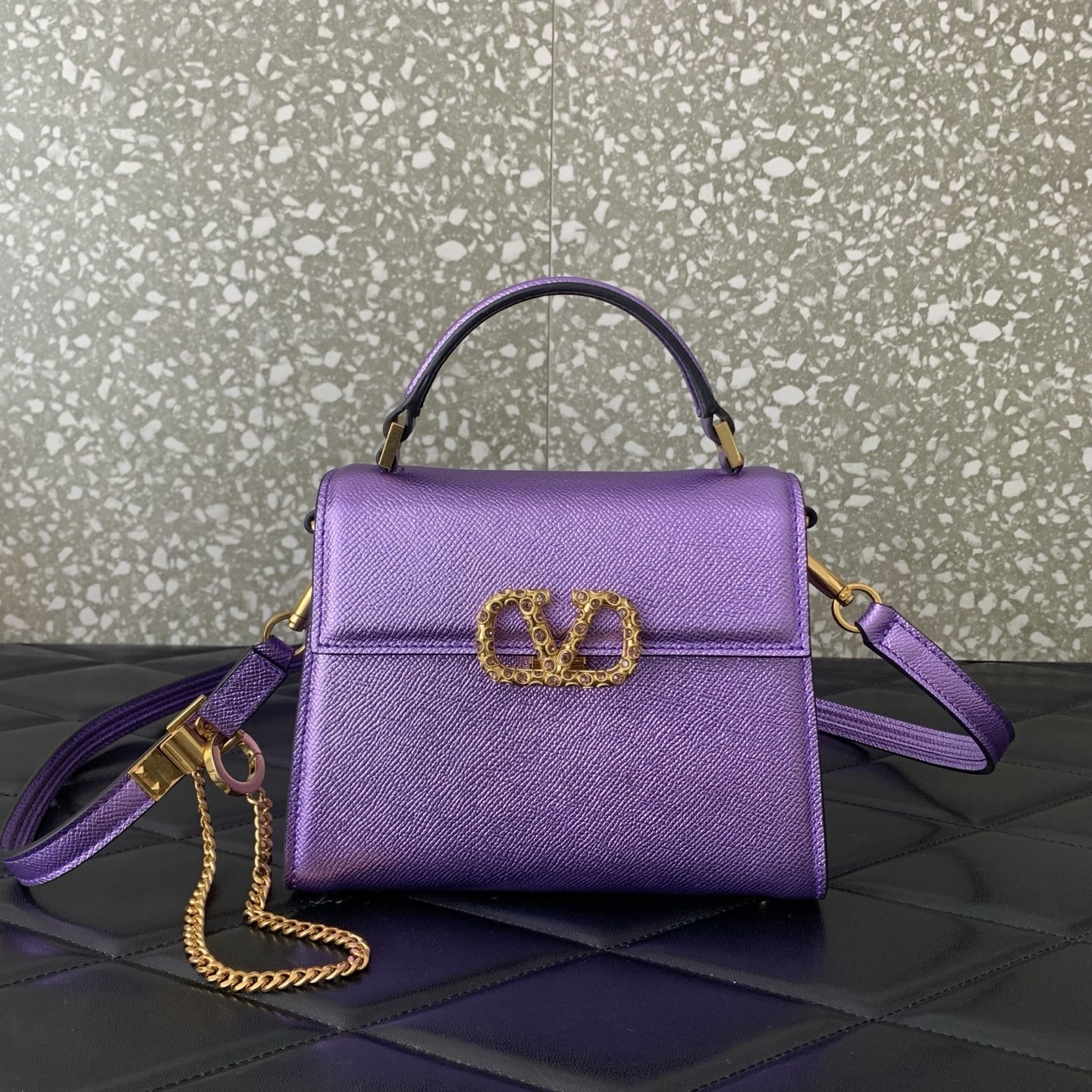 Valentino Garavani Vsling Mini Top-Handle Bag in purple metallic grainy calfskin with antique brass hardware