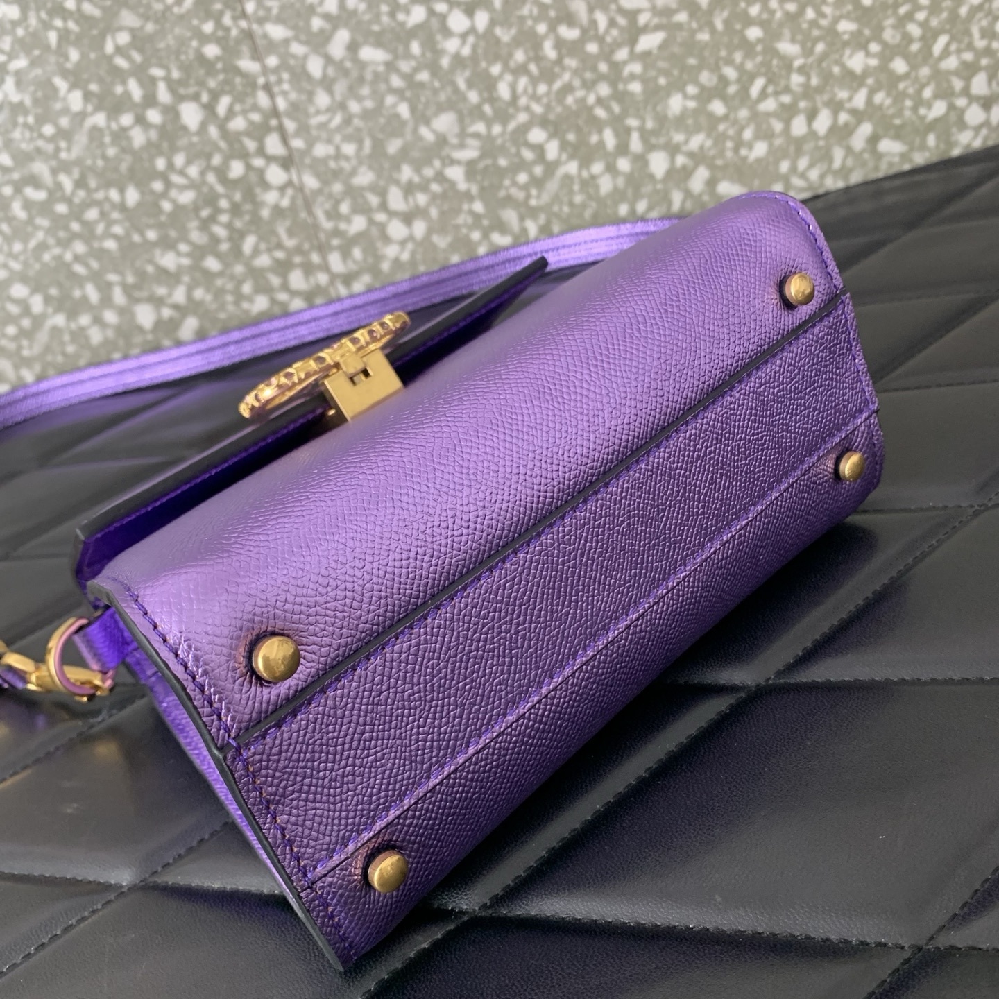 Valentino Garavani Vsling Mini Top-Handle Bag in purple metallic grainy calfskin with antique brass hardware