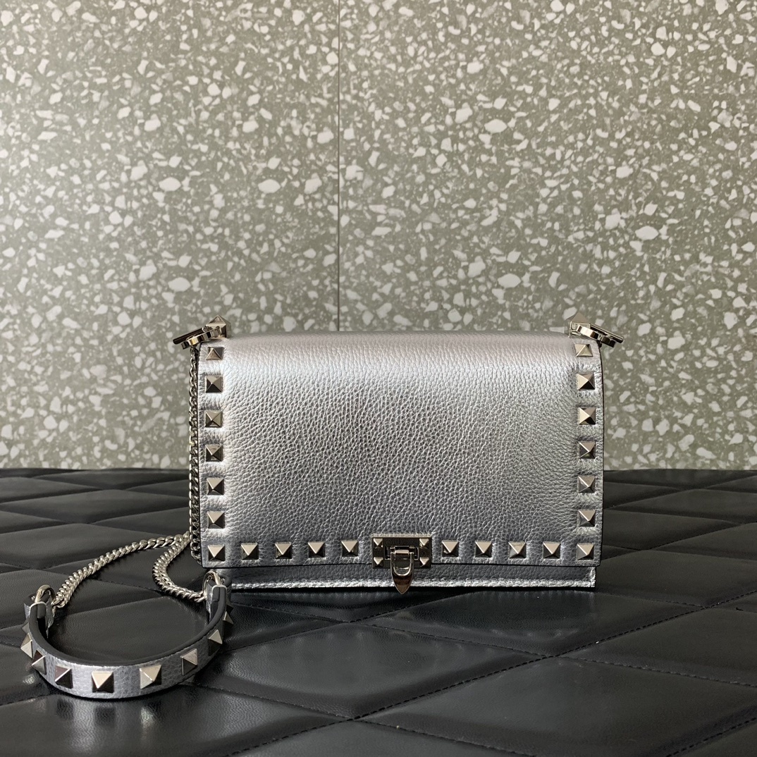 Valentino Garavani Rockstud metallic leather shoulder bag often referred to as a wallet on chain