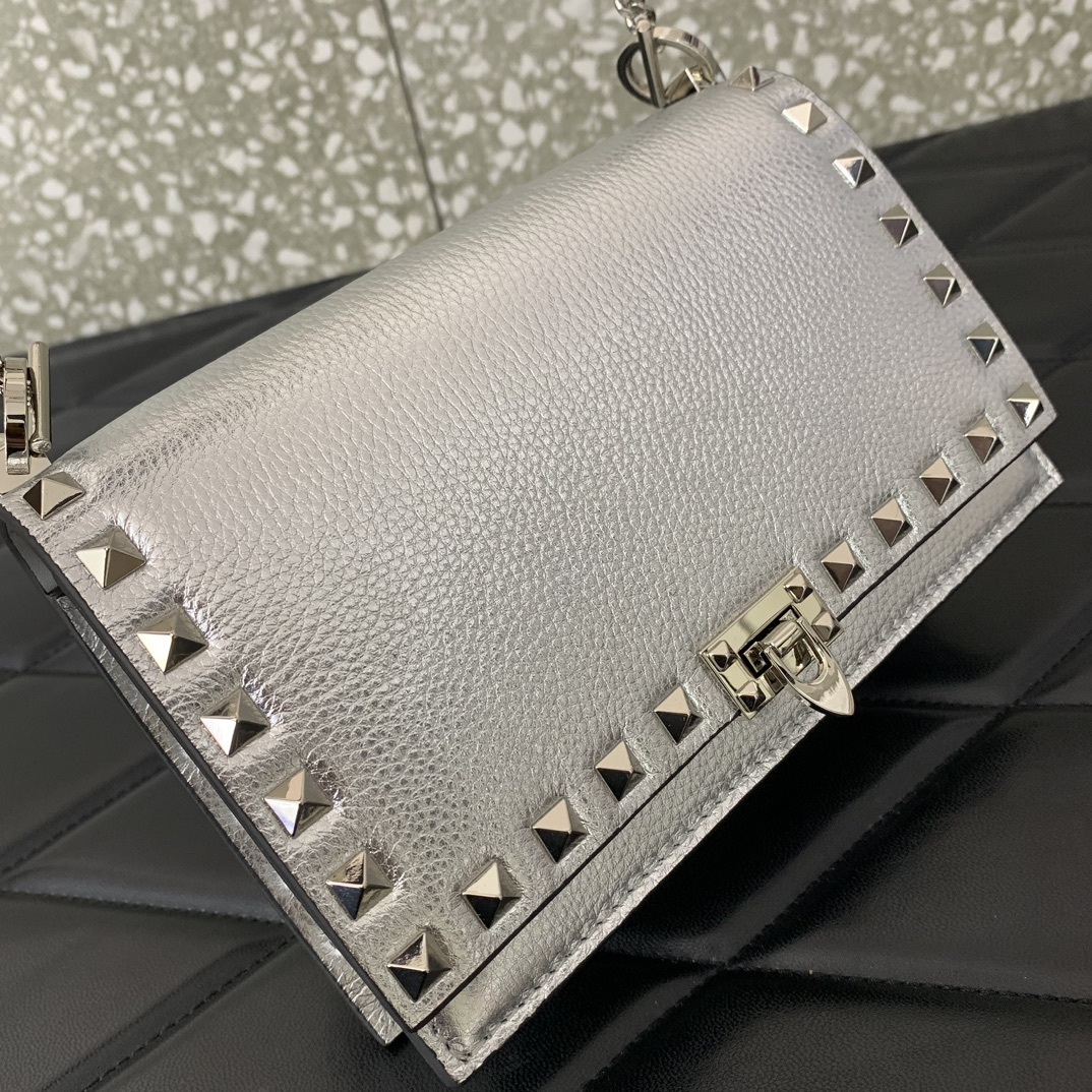 Valentino Garavani Rockstud metallic leather shoulder bag often referred to as a wallet on chain