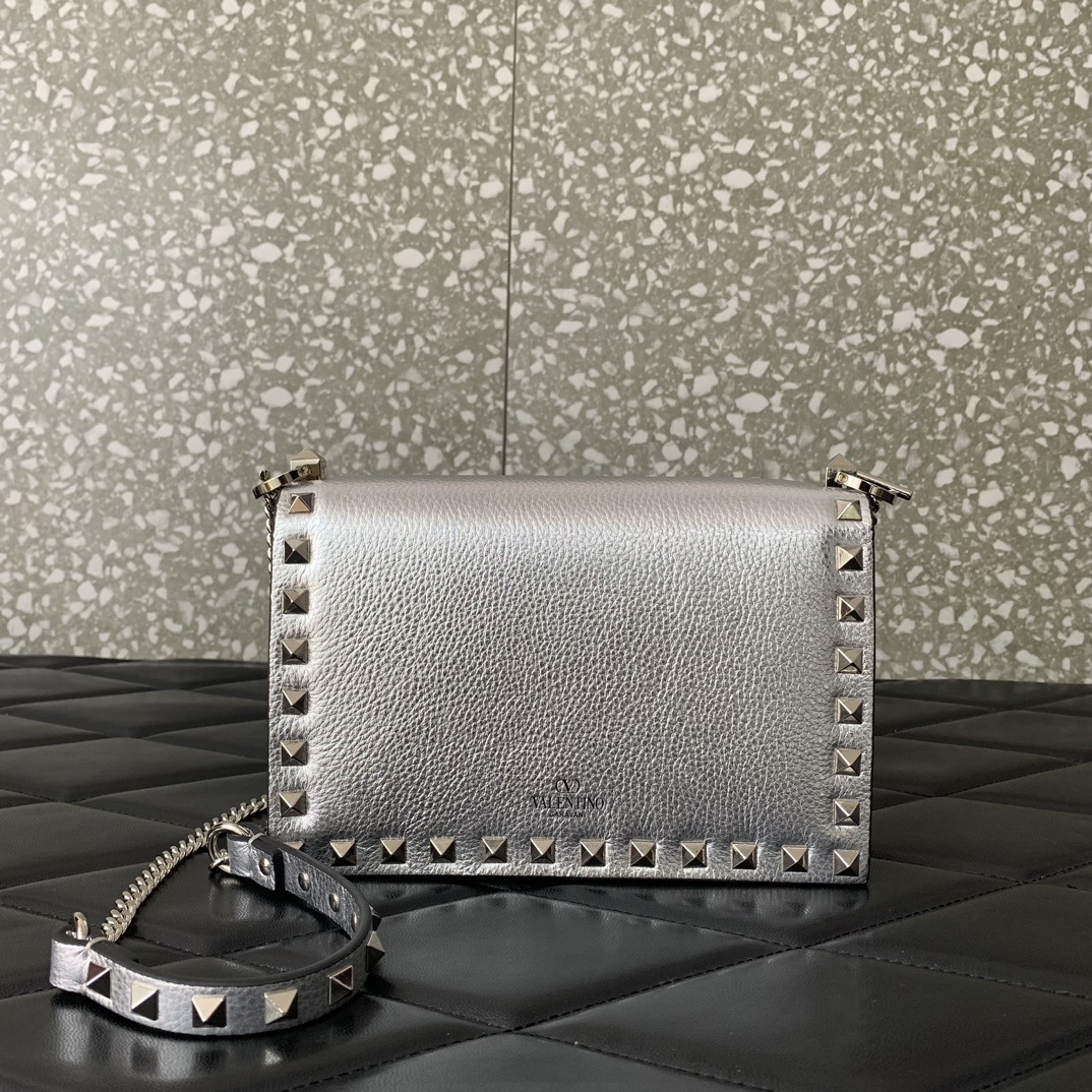Valentino Garavani Rockstud metallic leather shoulder bag often referred to as a wallet on chain