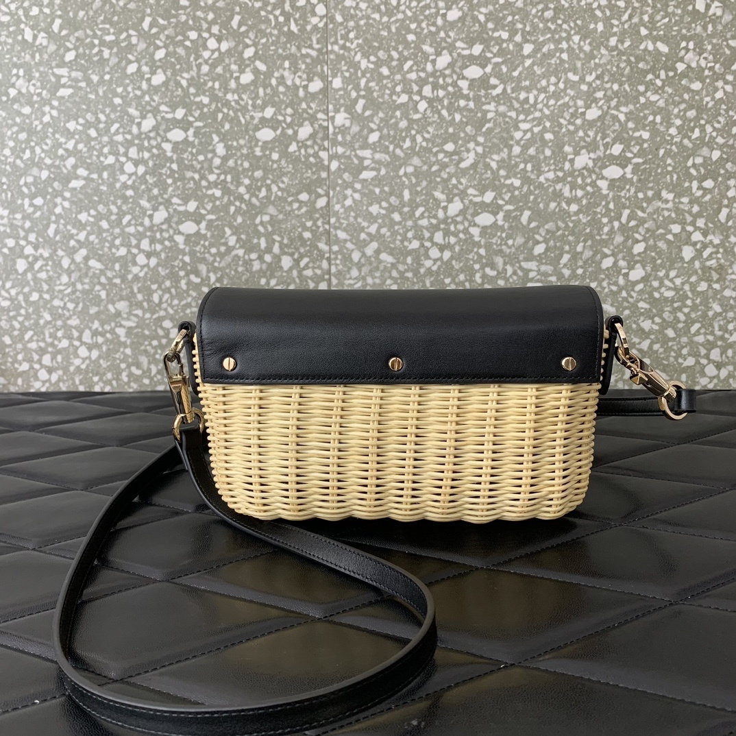 Valentino Garavani Locò straw shoulder bag featuring a VLogo Signature metallic element