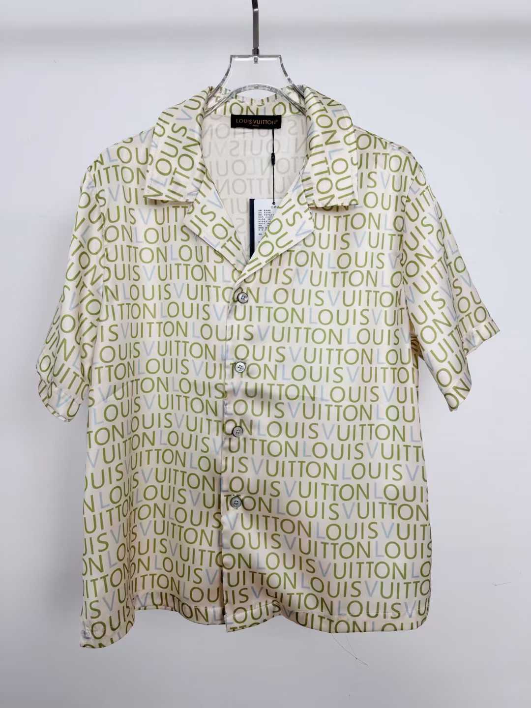 LV monogram short-sleeved shirt is a luxury item featuring an all-over print of the brand's name