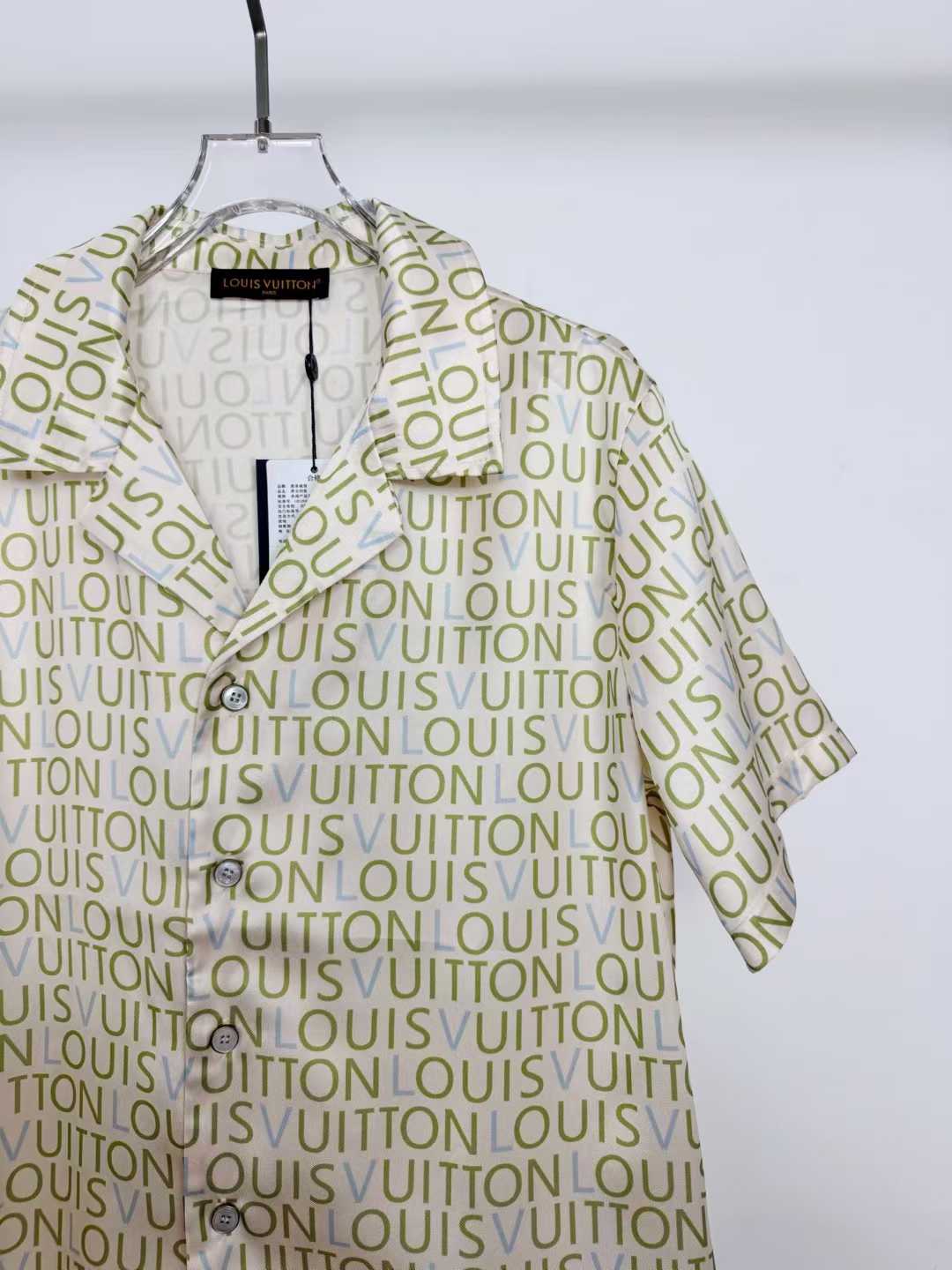 LV monogram short-sleeved shirt is a luxury item featuring an all-over print of the brand's name