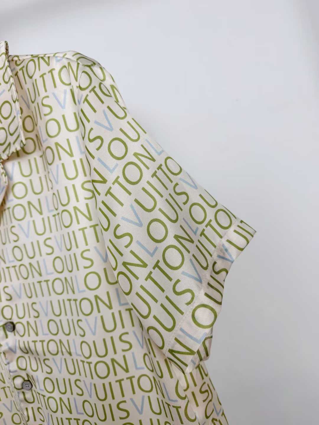 LV monogram short-sleeved shirt is a luxury item featuring an all-over print of the brand's name