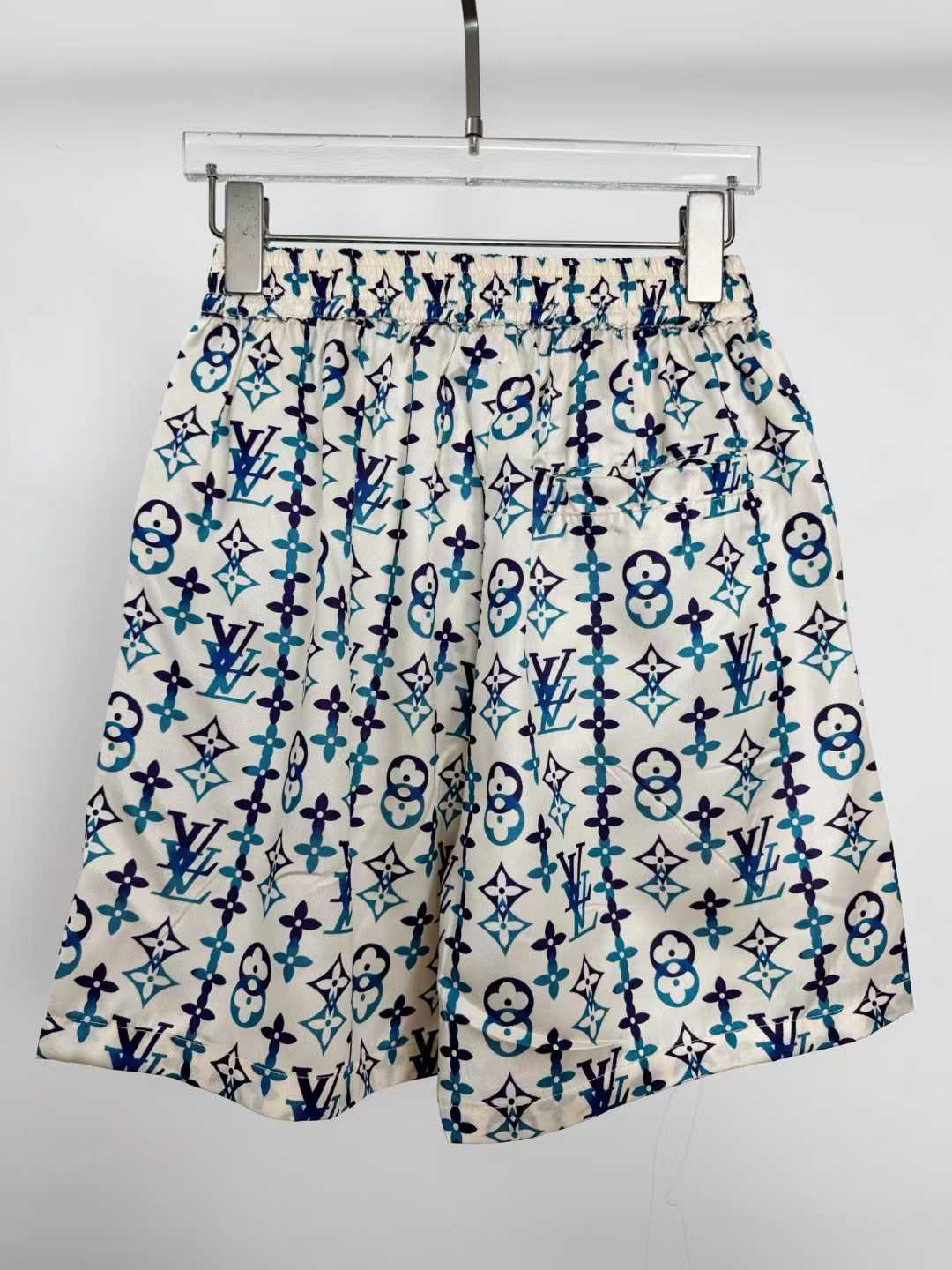 LV silk monogram shorts featuring a distinctive blue and white pattern