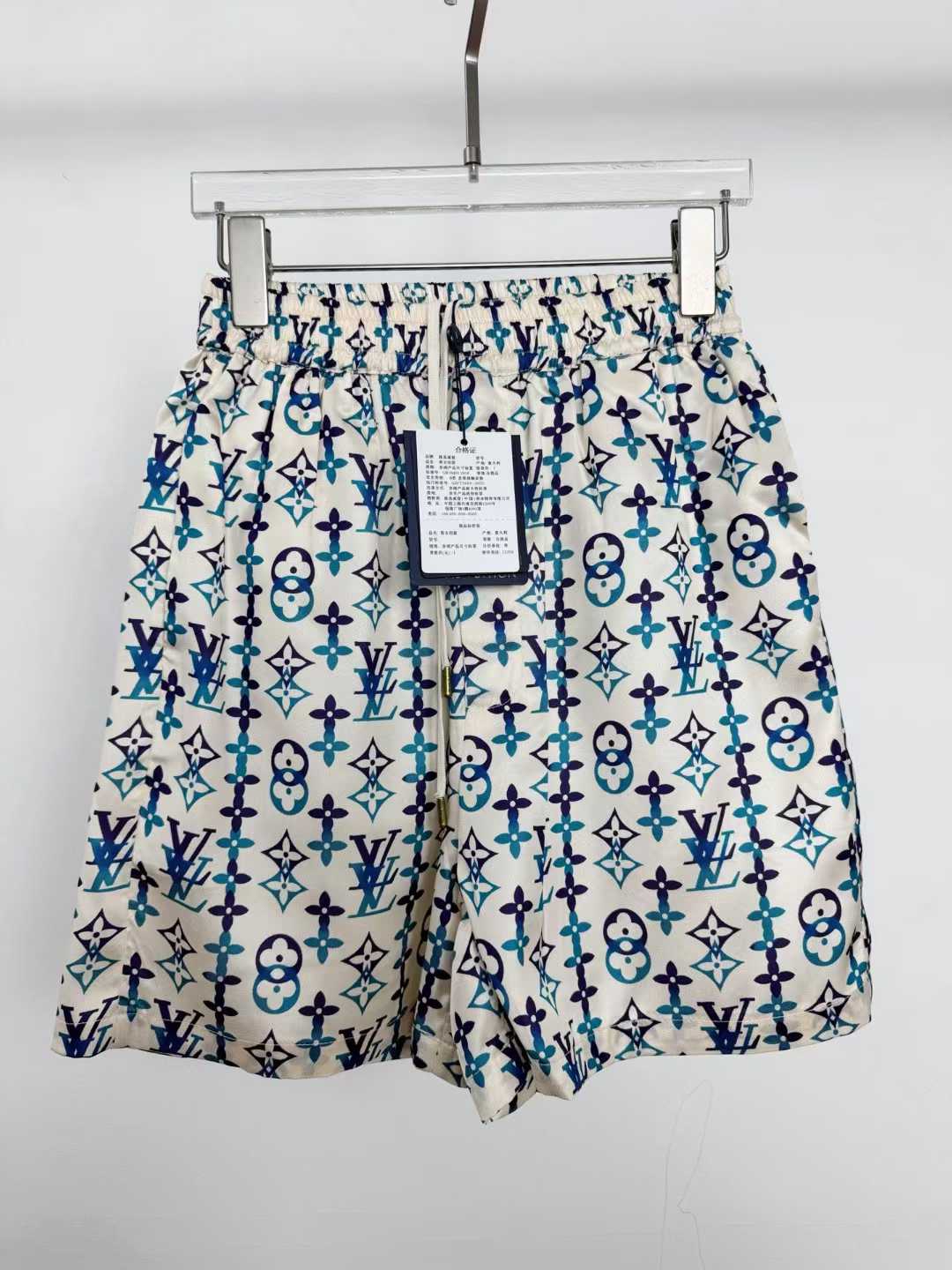 LV silk monogram shorts featuring a distinctive blue and white pattern