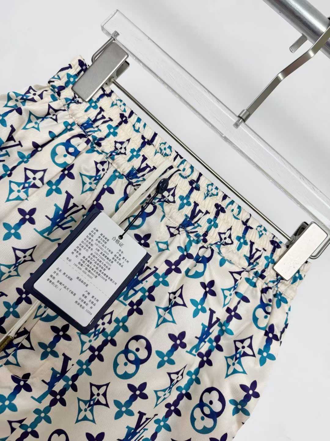 LV silk monogram shorts featuring a distinctive blue and white pattern