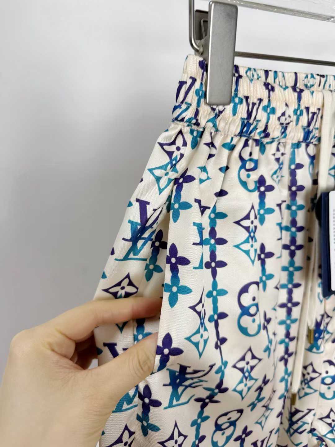 LV silk monogram shorts featuring a distinctive blue and white pattern