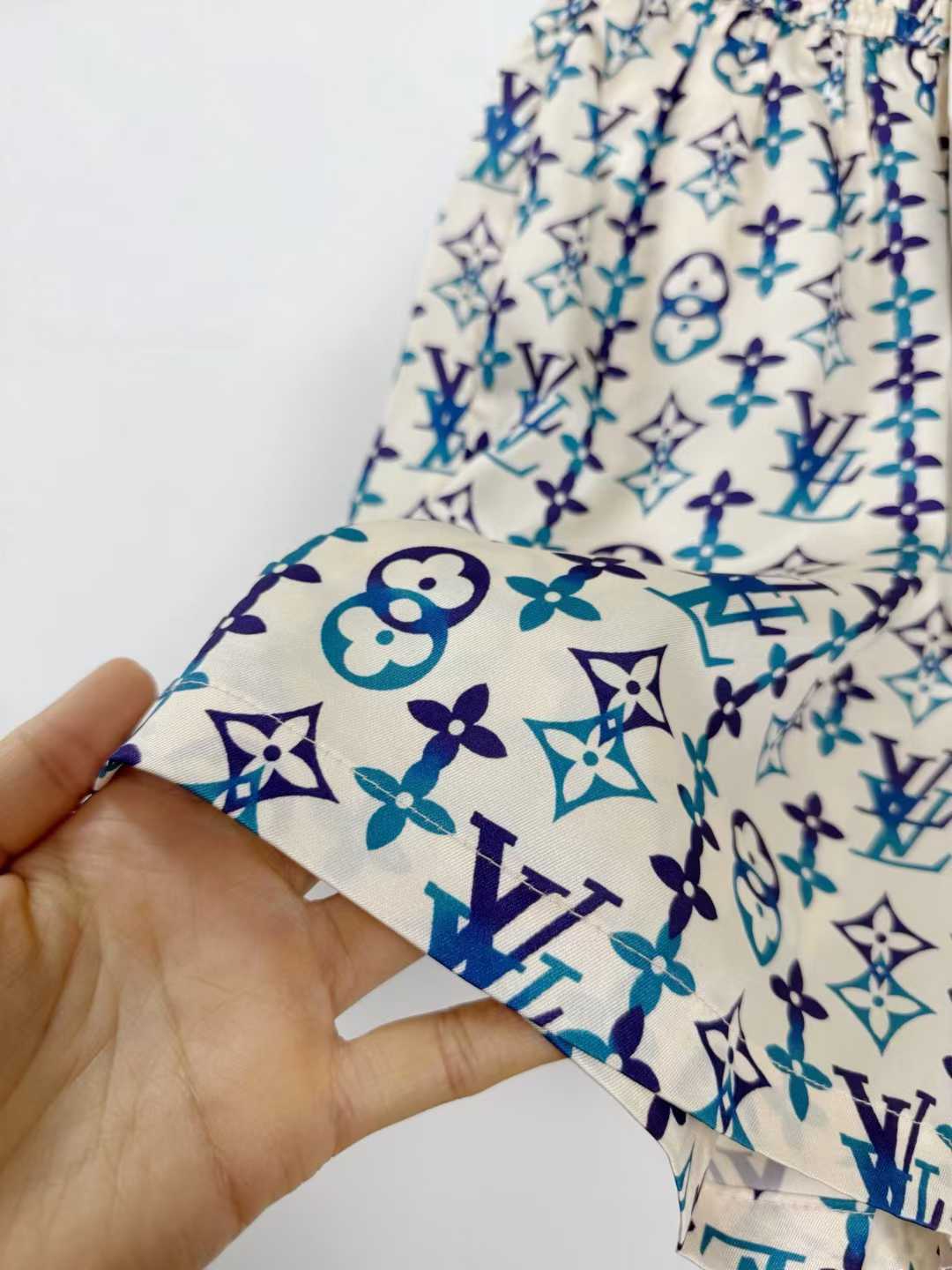 LV silk monogram shorts featuring a distinctive blue and white pattern