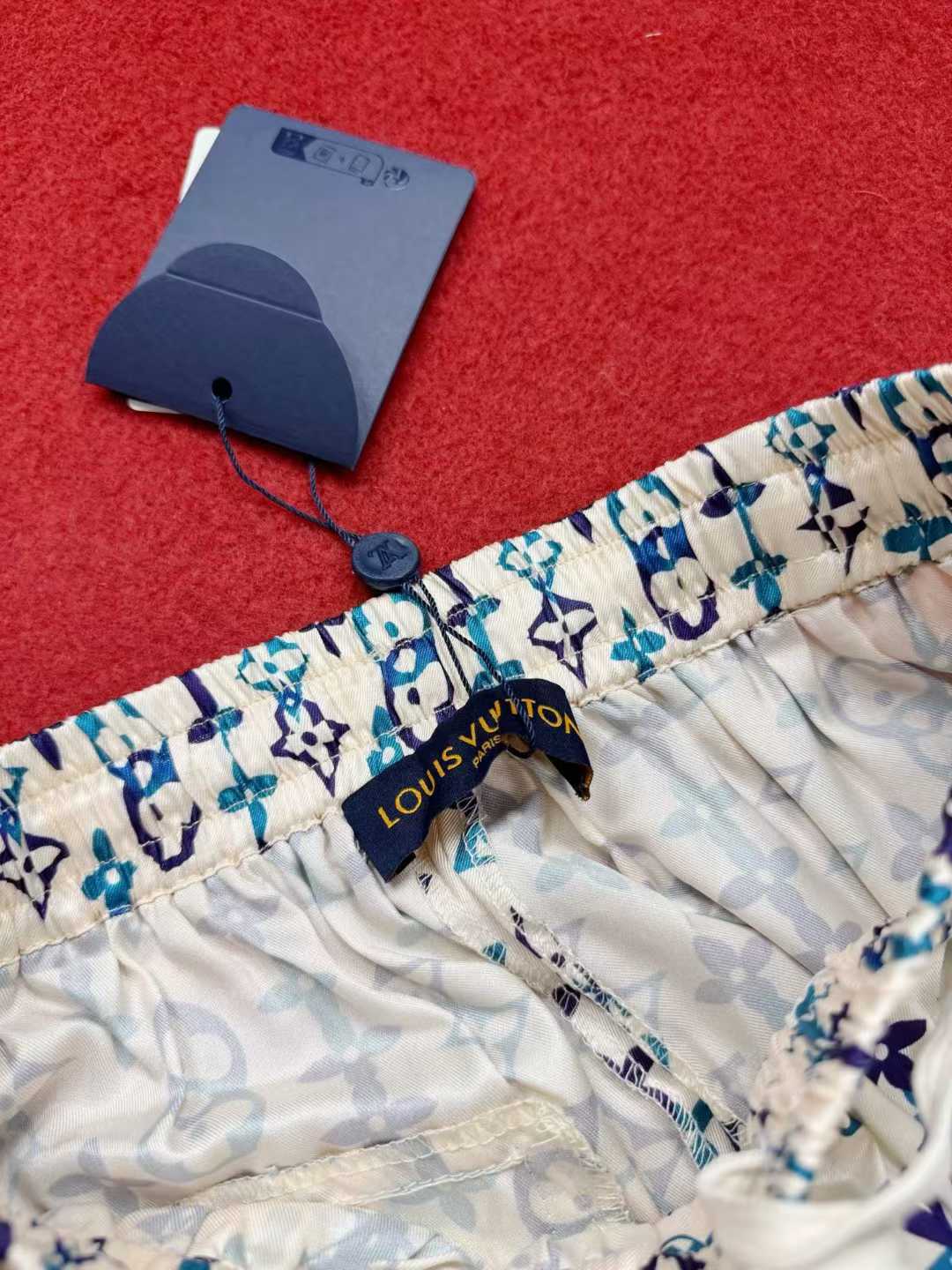 LV silk monogram shorts featuring a distinctive blue and white pattern