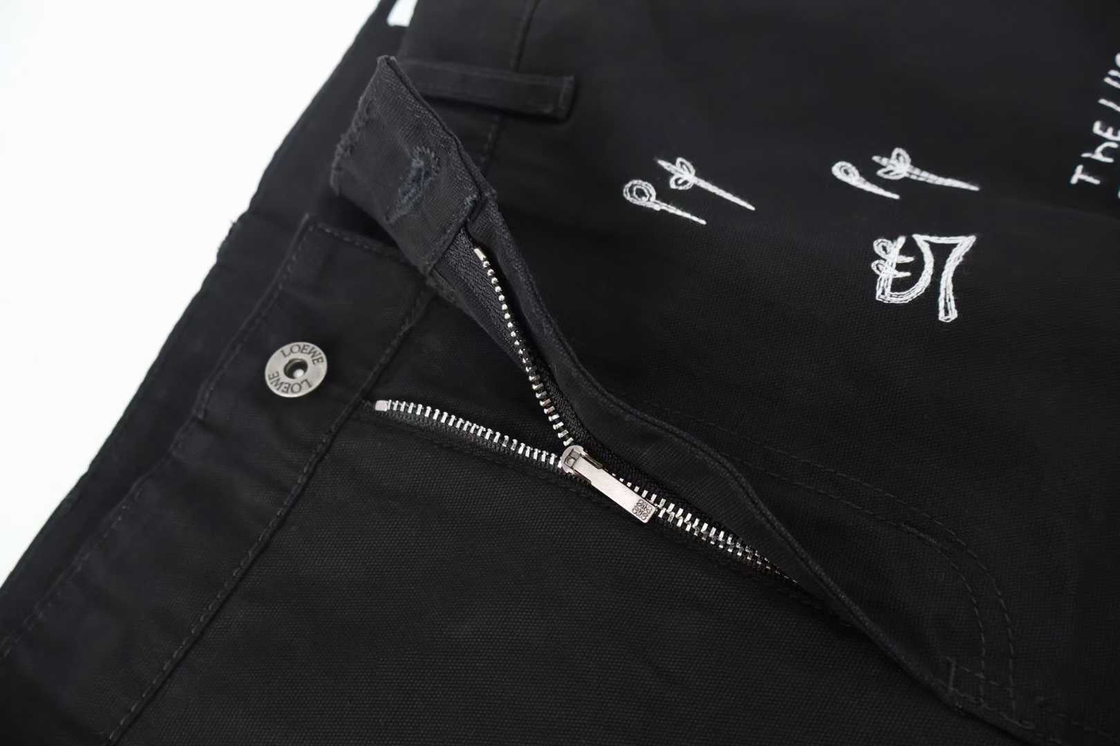 Loewe x Louis Wain embroidered wide-leg jeans in black, featuring playful animal appliqués inspired by the British artist's "Futurist Cats" series