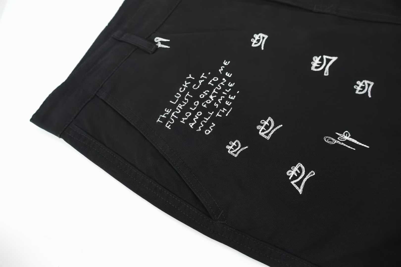 Loewe x Louis Wain embroidered wide-leg jeans in black, featuring playful animal appliqués inspired by the British artist's "Futurist Cats" series