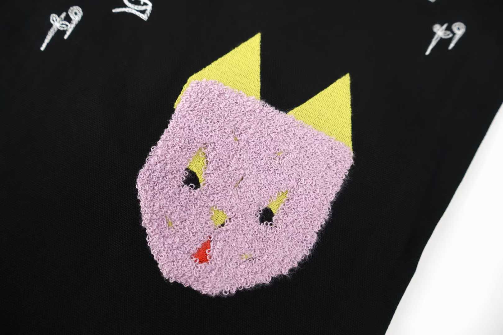 Loewe x Louis Wain embroidered wide-leg jeans in black, featuring playful animal appliqués inspired by the British artist's "Futurist Cats" series