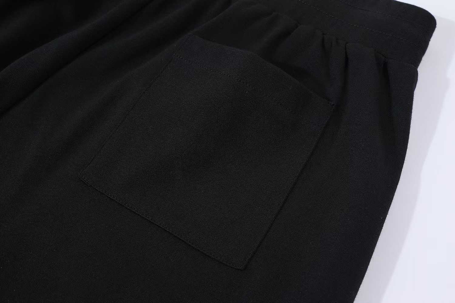 LV Embellished Jersey Shorts featuring a tone-on-tone iridescent rhinestone LV signature on the leg