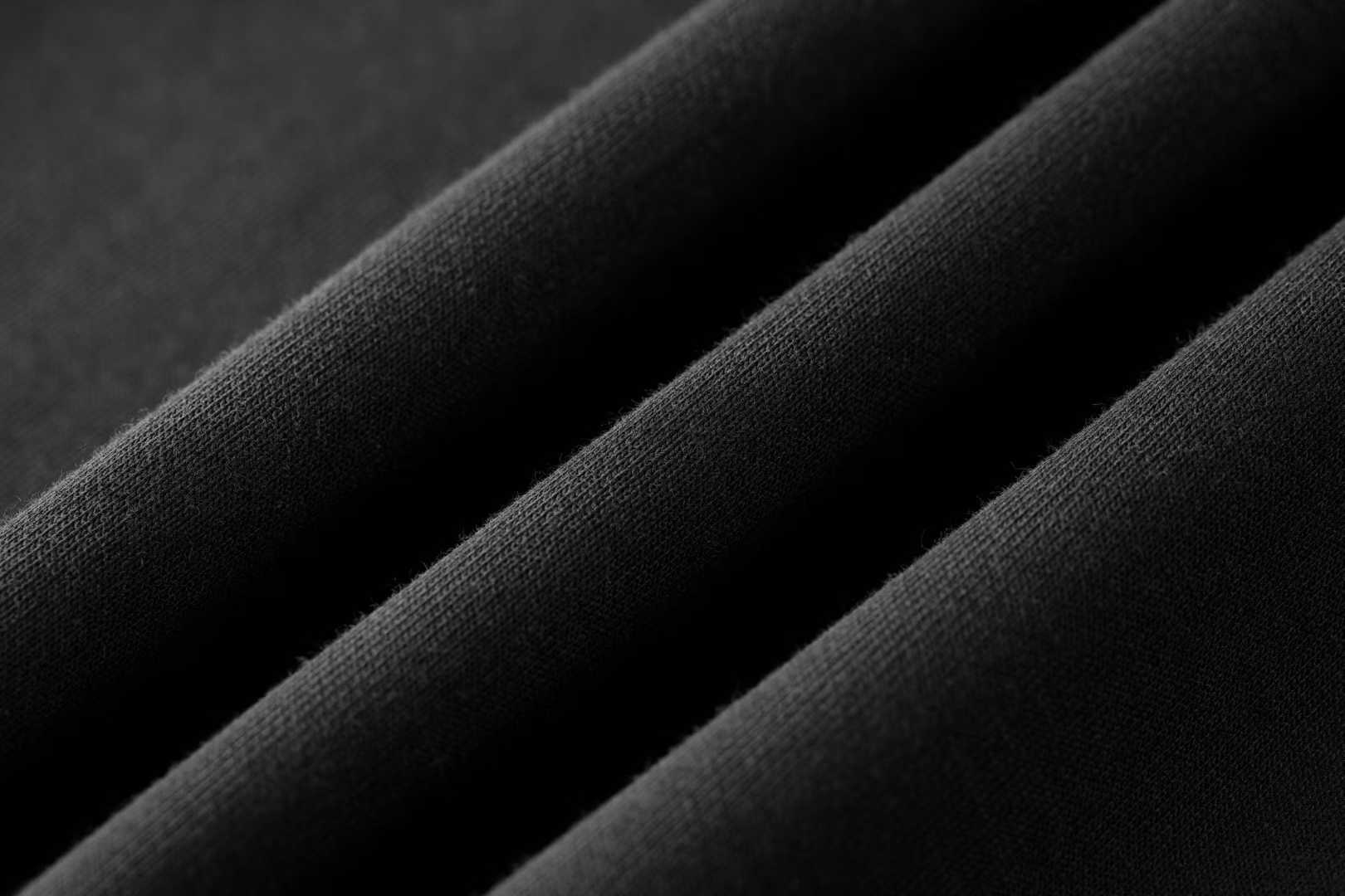 LV Embellished Jersey T-shirt a black cotton shirt featuring an iridescent rhinestone LV signature on the chest.