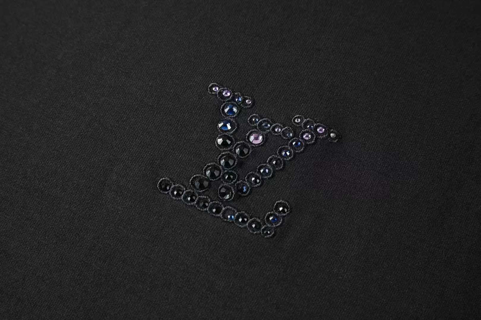 LV Embellished Jersey T-shirt a black cotton shirt featuring an iridescent rhinestone LV signature on the chest.