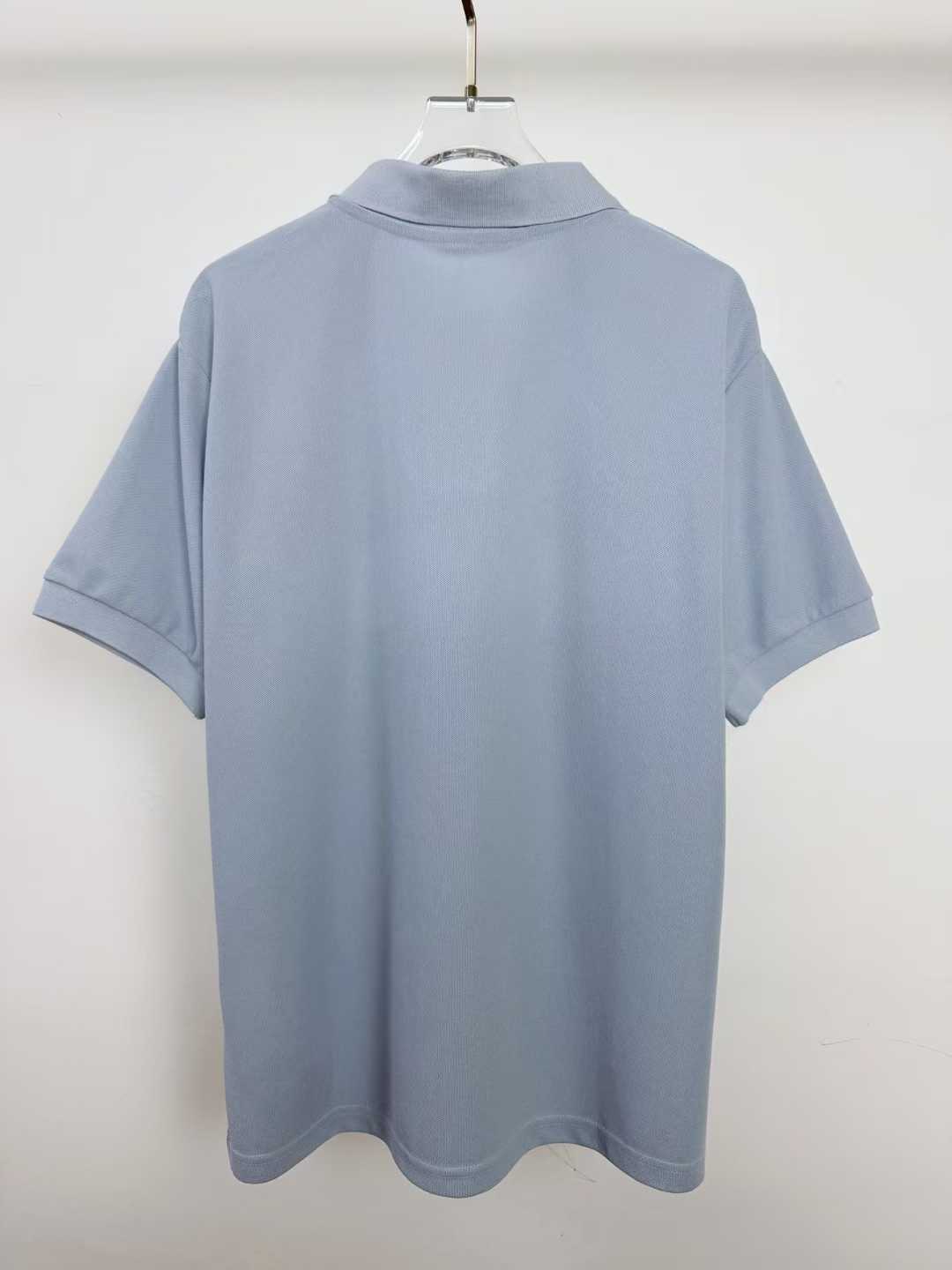 LV short-sleeved polo shirt features horizontal brown and white bands across the torso