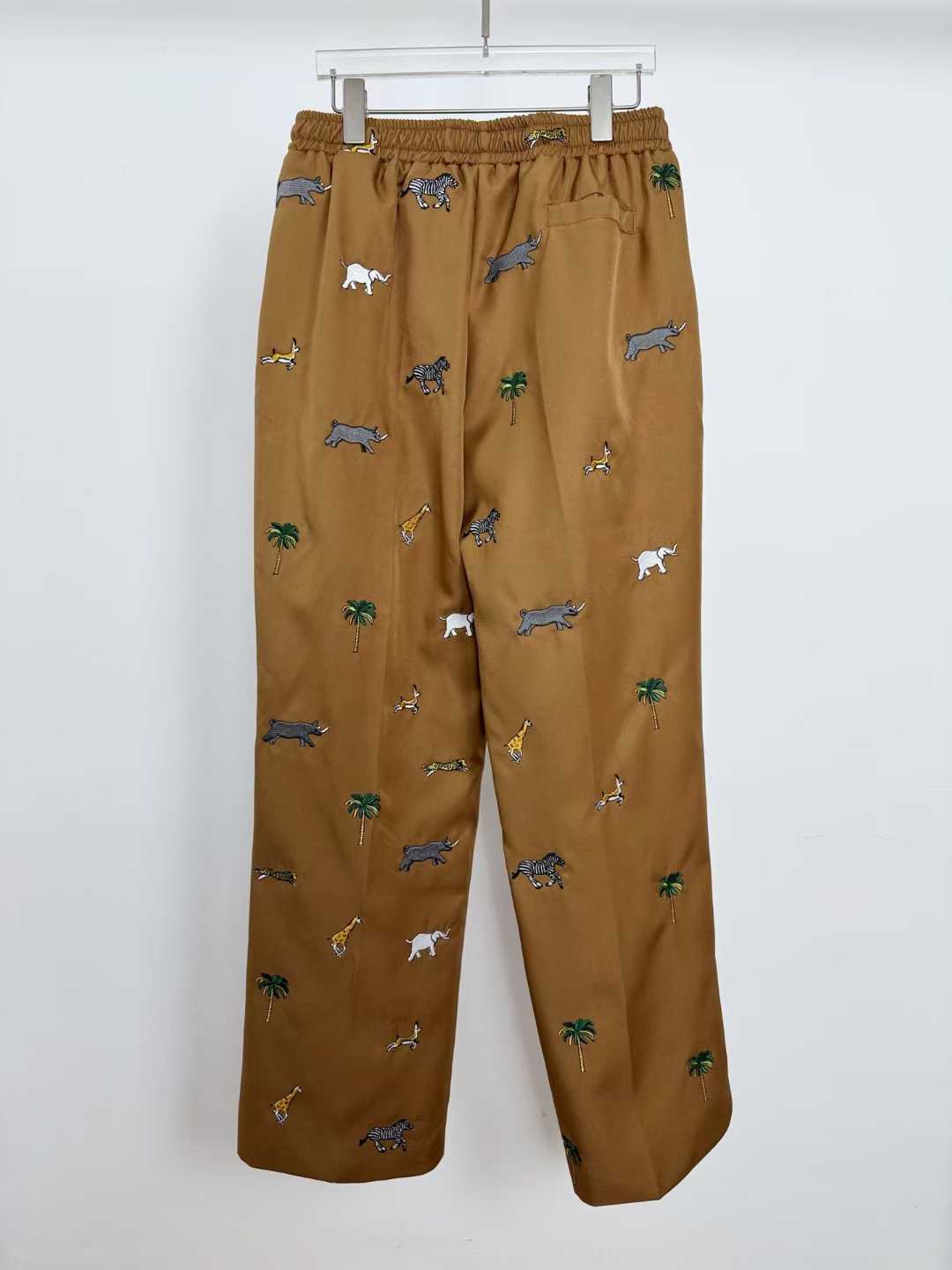 LV x The Darjeeling Limited Fil Coupe drawstring pants featuring an all-over motif