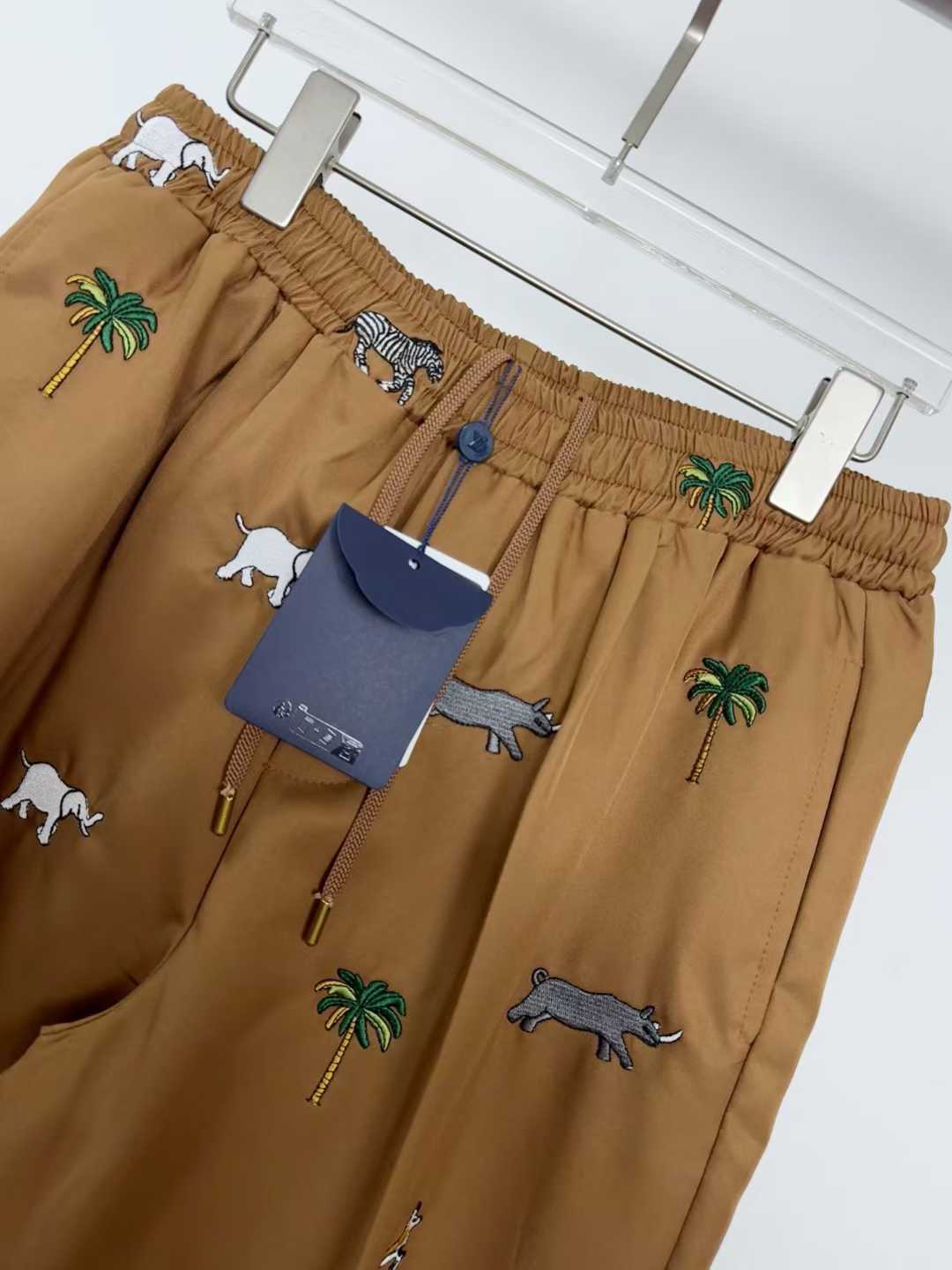 LV x The Darjeeling Limited Fil Coupe drawstring pants featuring an all-over motif