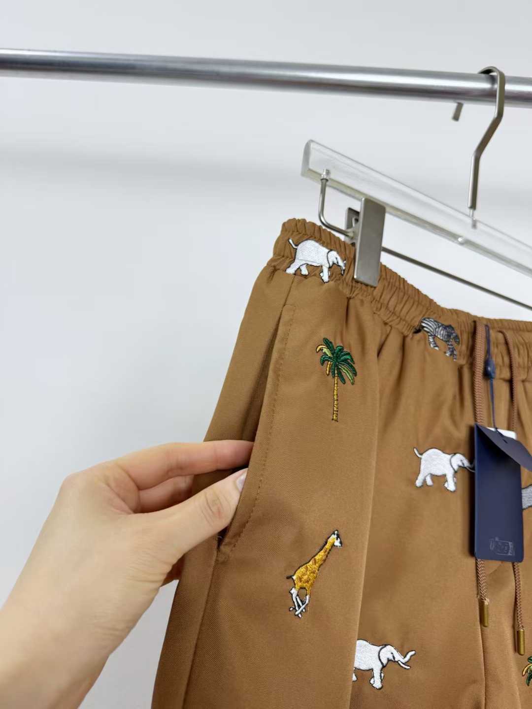 LV x The Darjeeling Limited Fil Coupe drawstring pants featuring an all-over motif