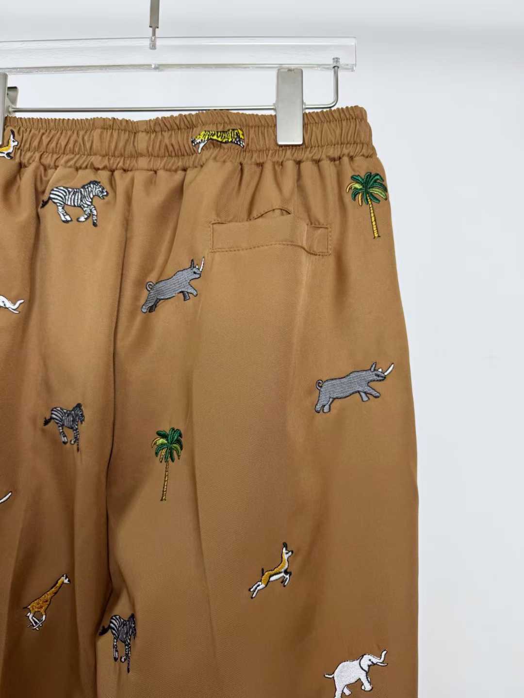 LV x The Darjeeling Limited Fil Coupe drawstring pants featuring an all-over motif