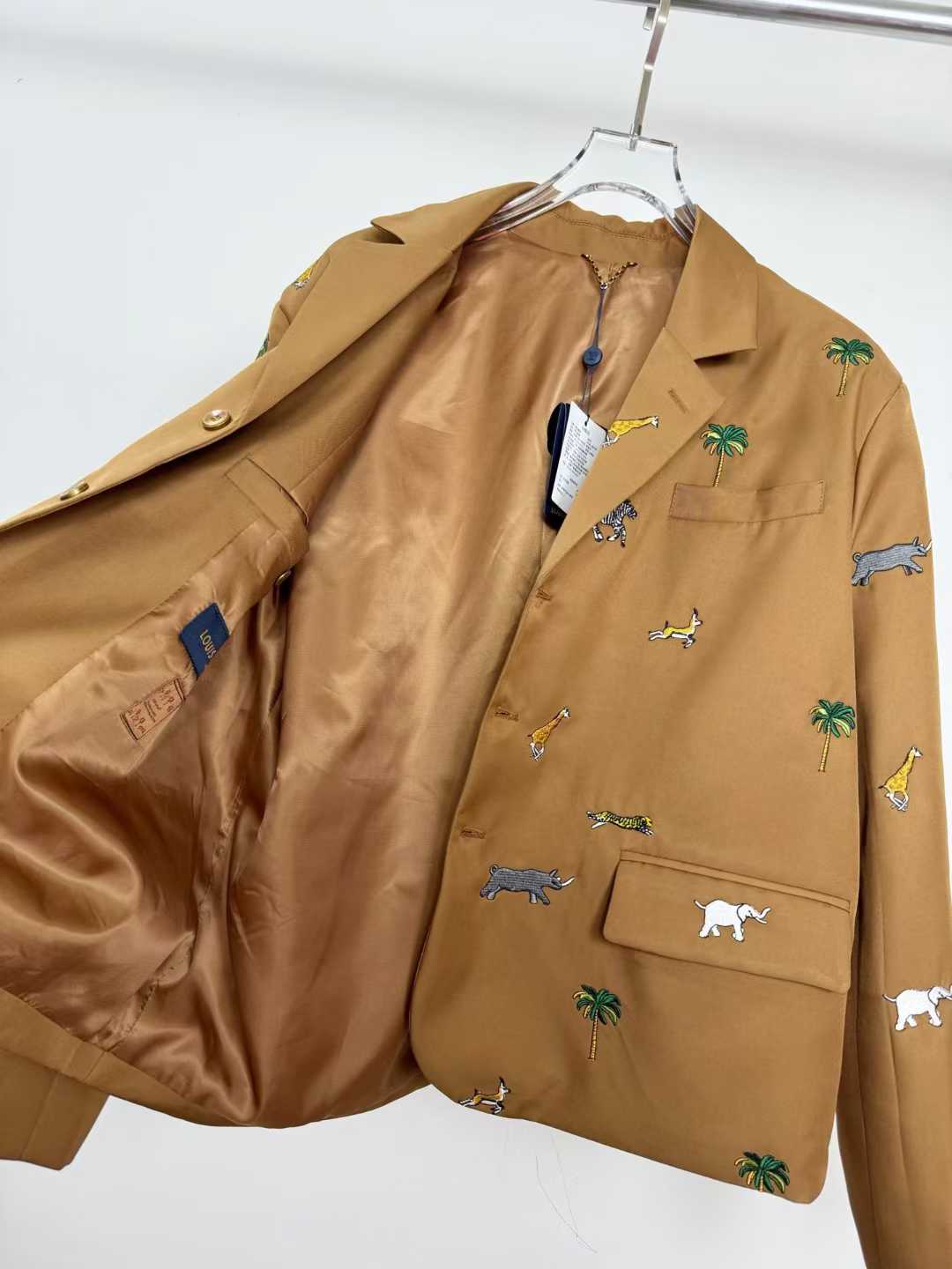 LV x The Darjeeling Limited Single-Breasted Jacket in caramel wool, featuring an all-over fil coupé jacquard motif of flora and fauna
