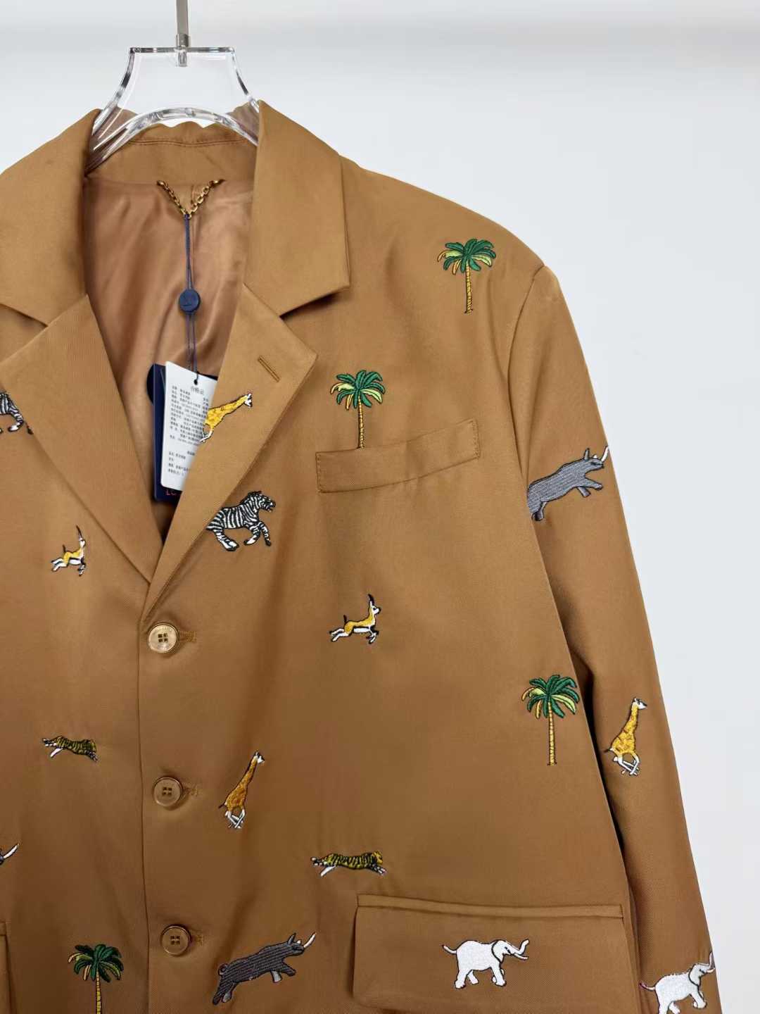LV x The Darjeeling Limited Single-Breasted Jacket in caramel wool, featuring an all-over fil coupé jacquard motif of flora and fauna