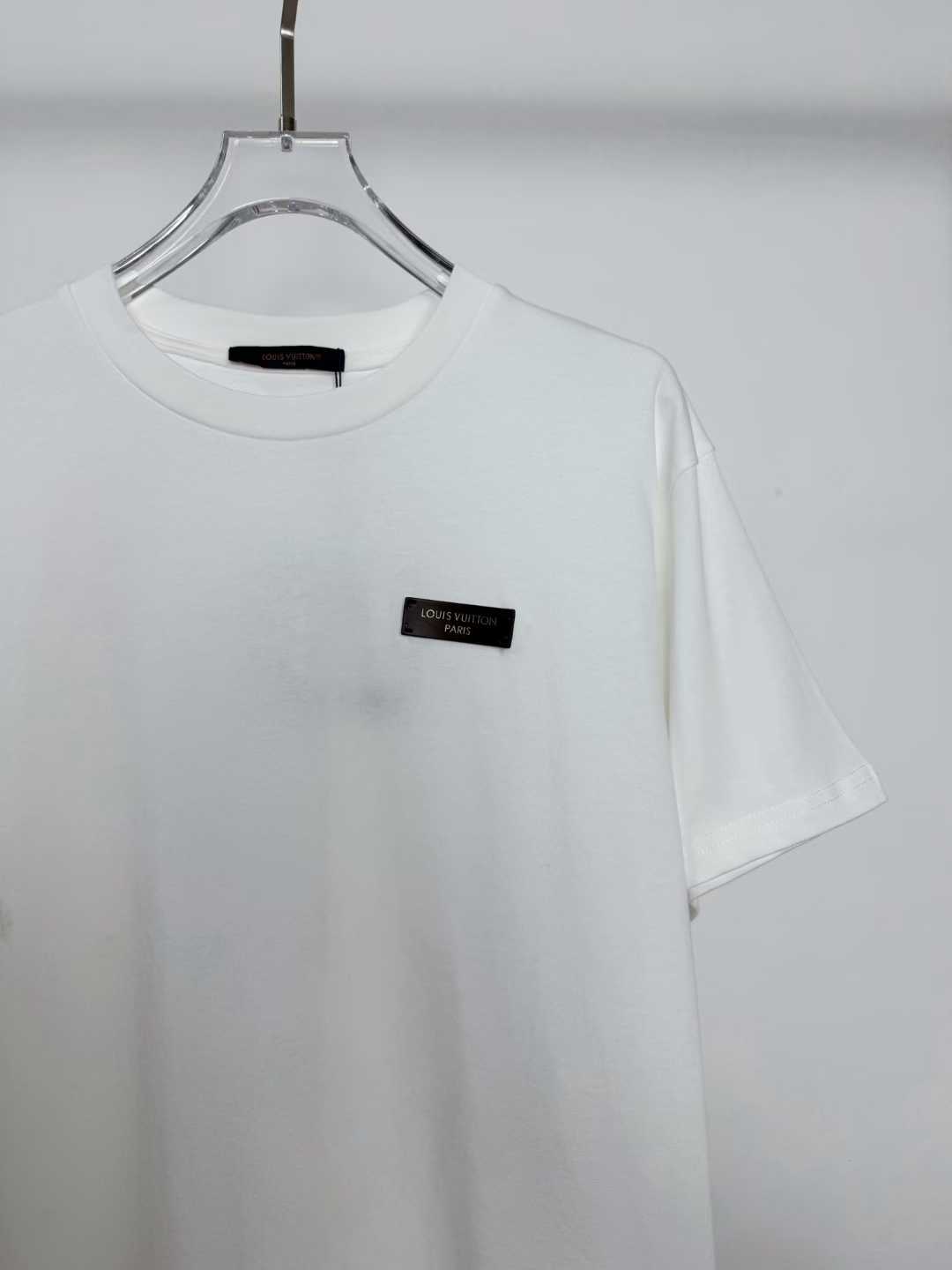 LV white cotton T-shirt featuring a branded metal logo plaque on the chest