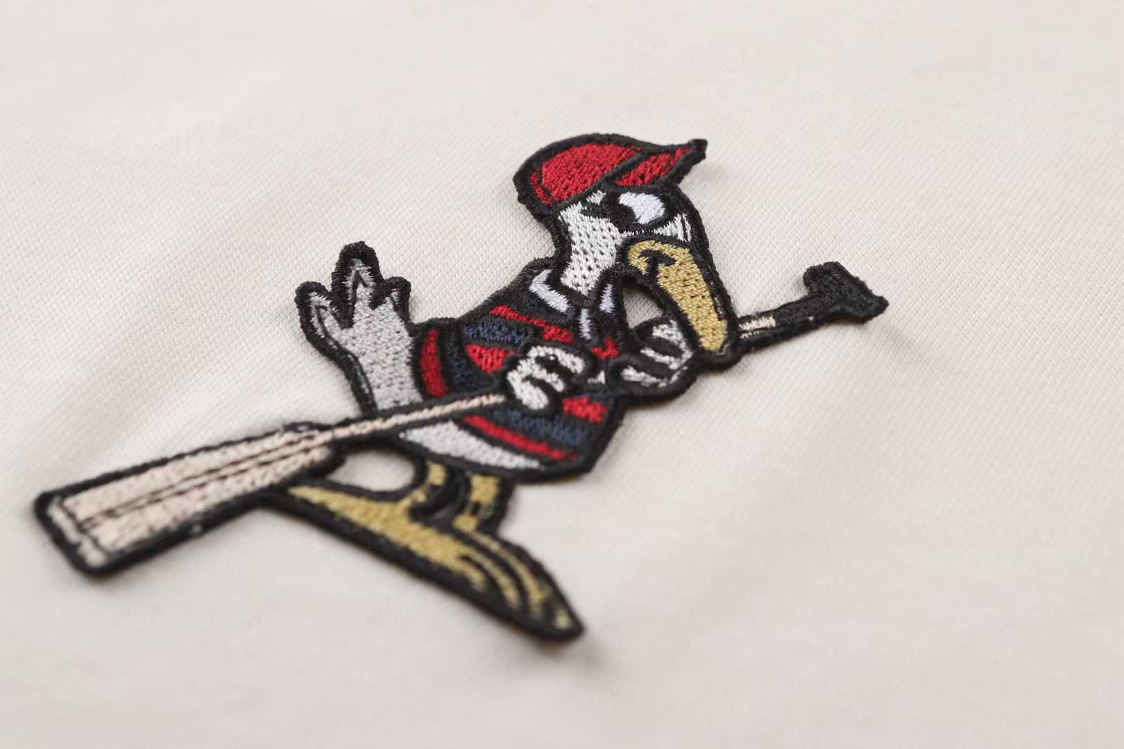 Moncler striped-collar T-shirt featuring a distinctive MonDuck logo patch