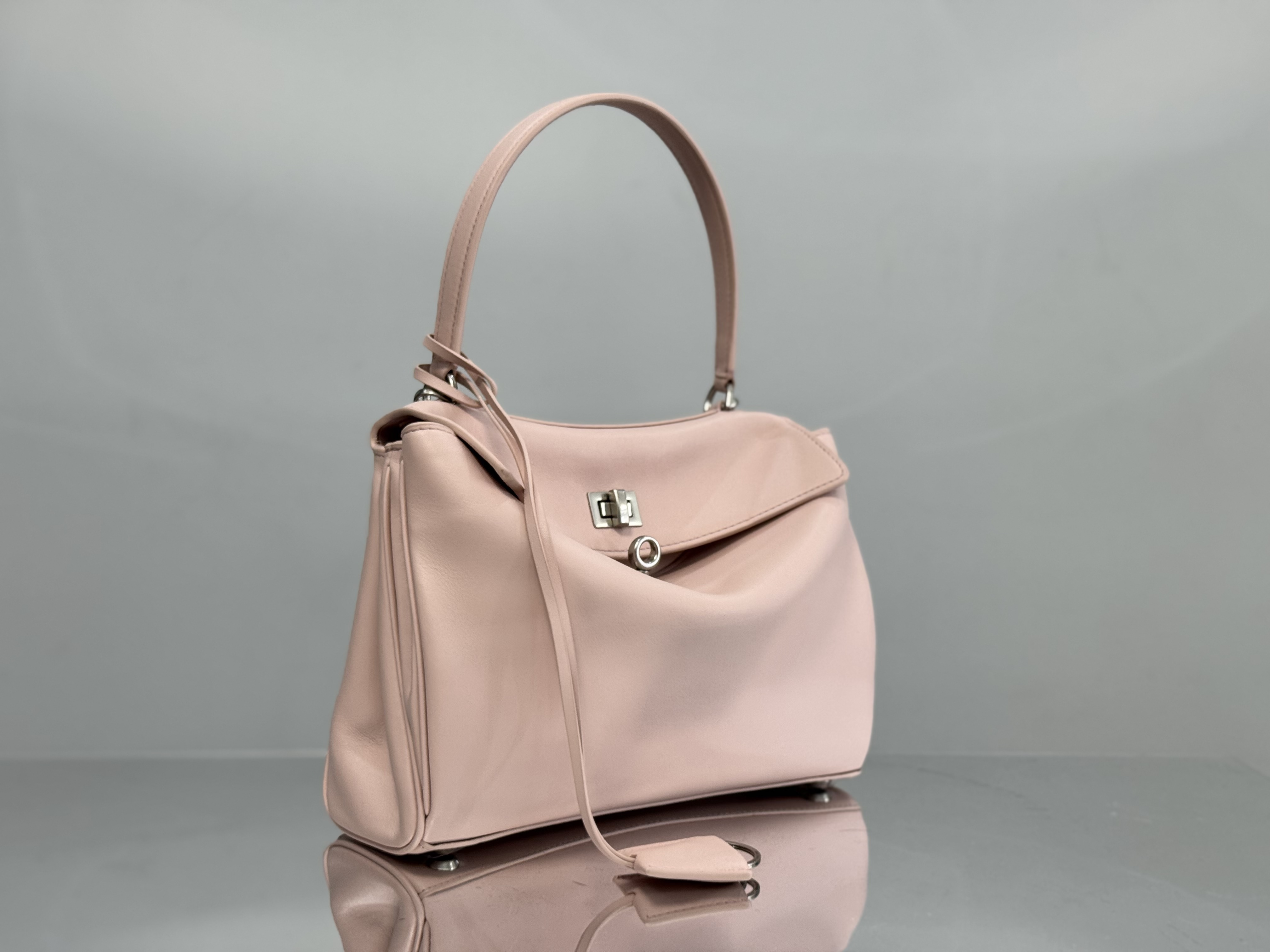 Balenciaga Rodeo handbag likely in a pink or beige calf leather.