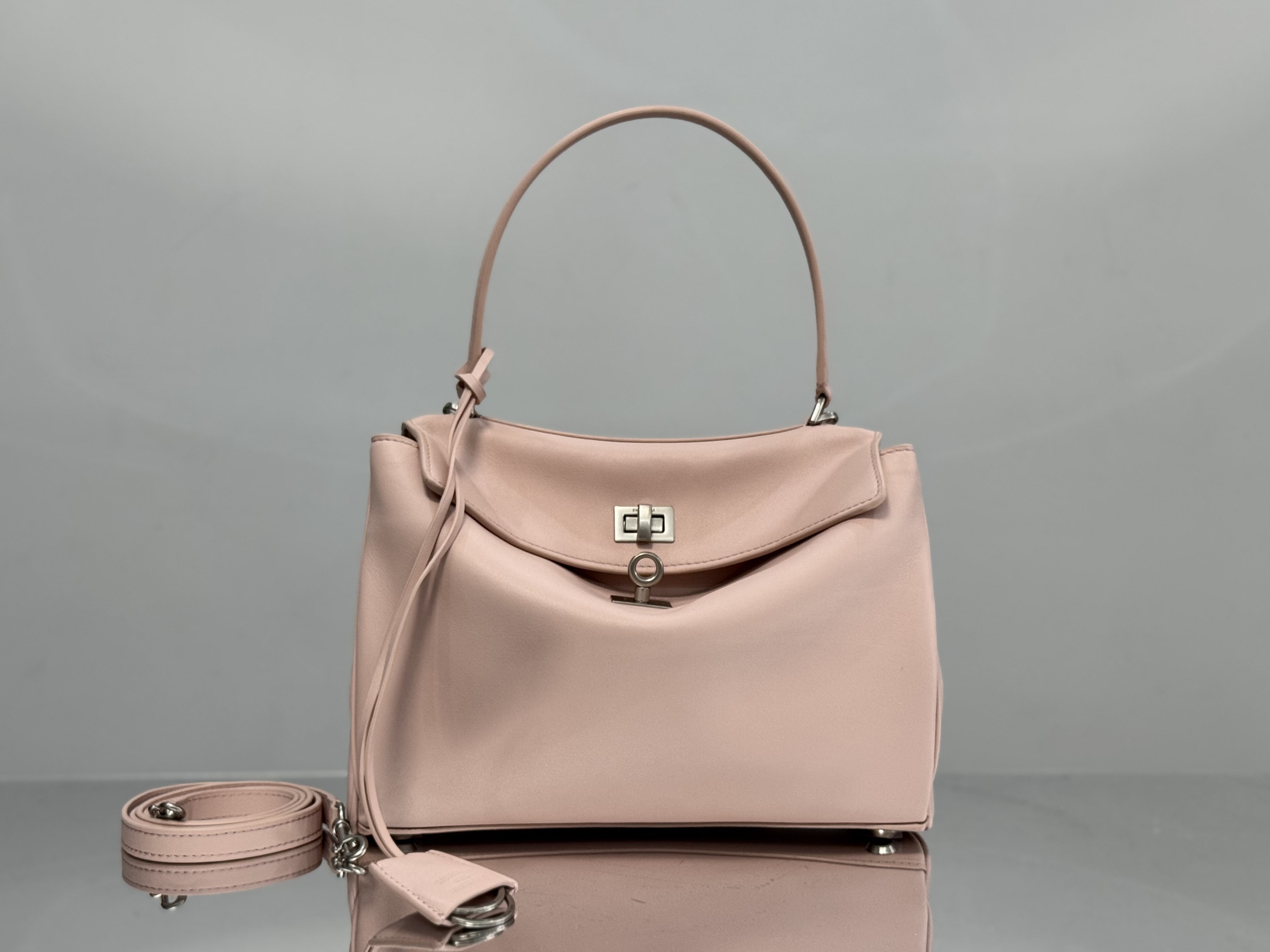 Balenciaga Rodeo handbag likely in a pink or beige calf leather.