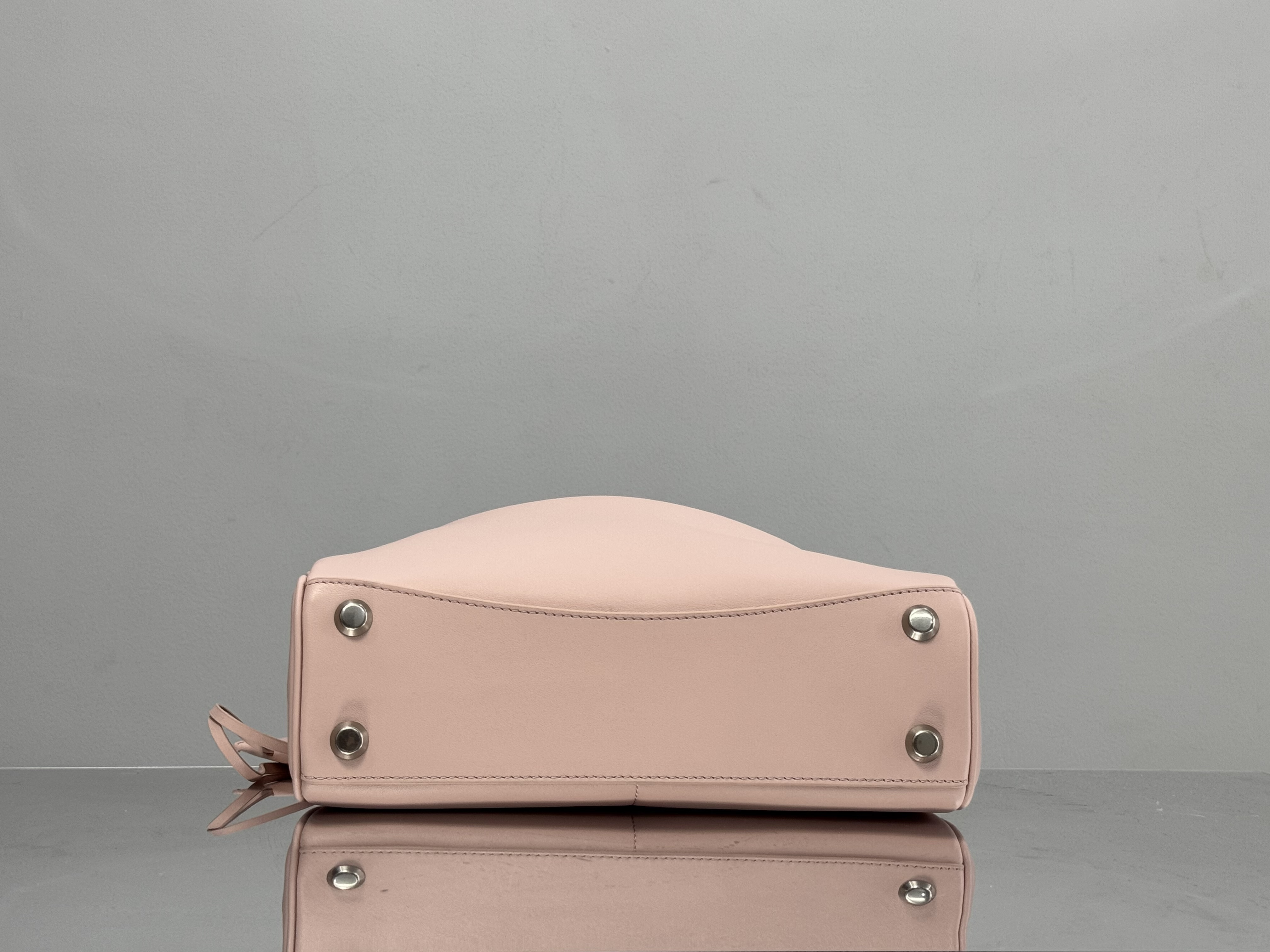 Balenciaga Rodeo handbag likely in a pink or beige calf leather.