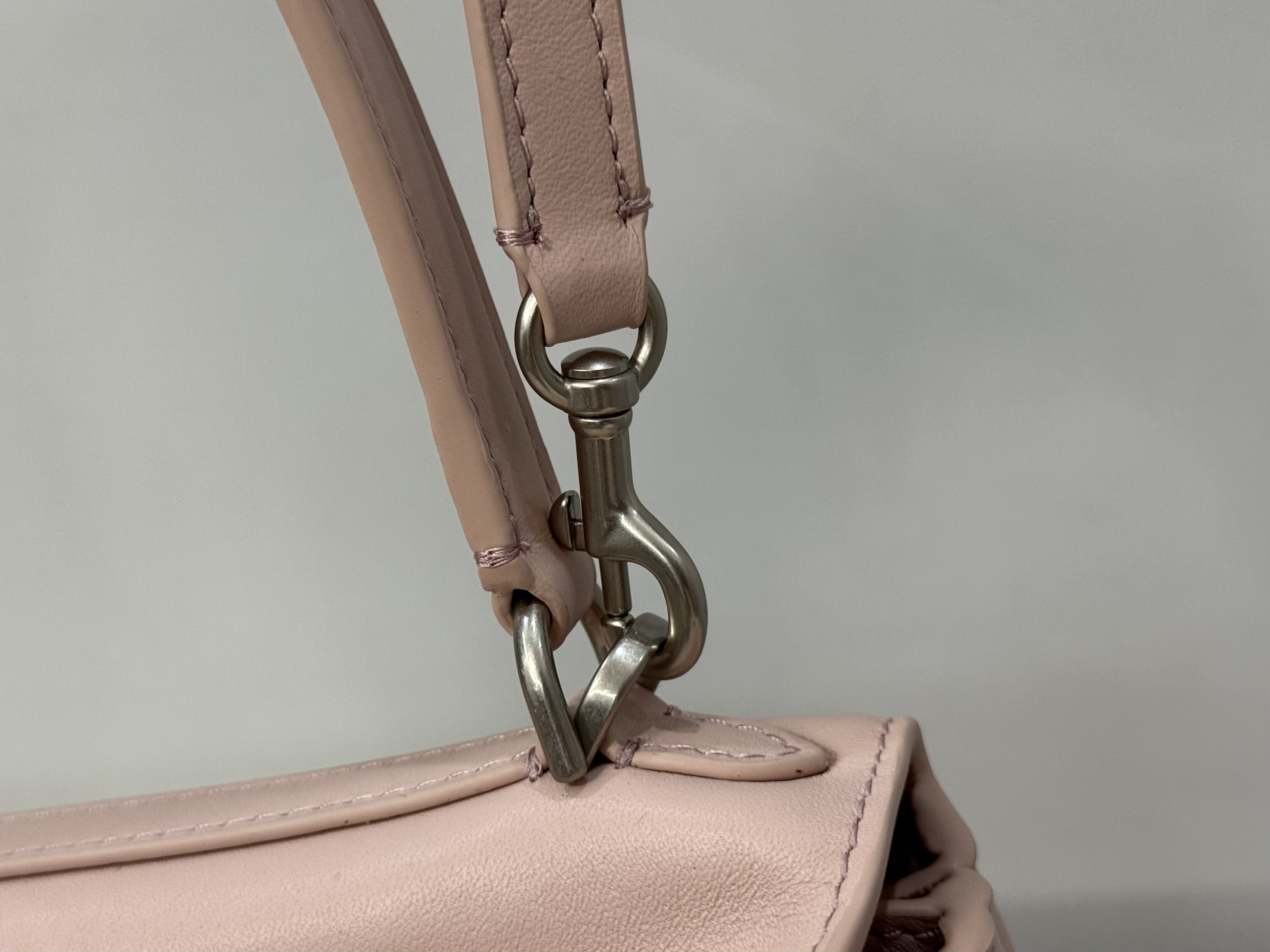 Balenciaga Rodeo handbag likely in a pink or beige calf leather.