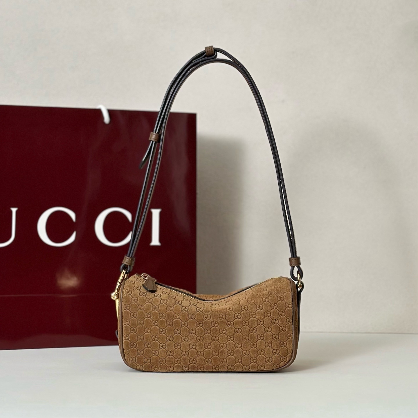 Gucci Half Horsebit mini bag featuring brown suede with a debossed GG pattern.